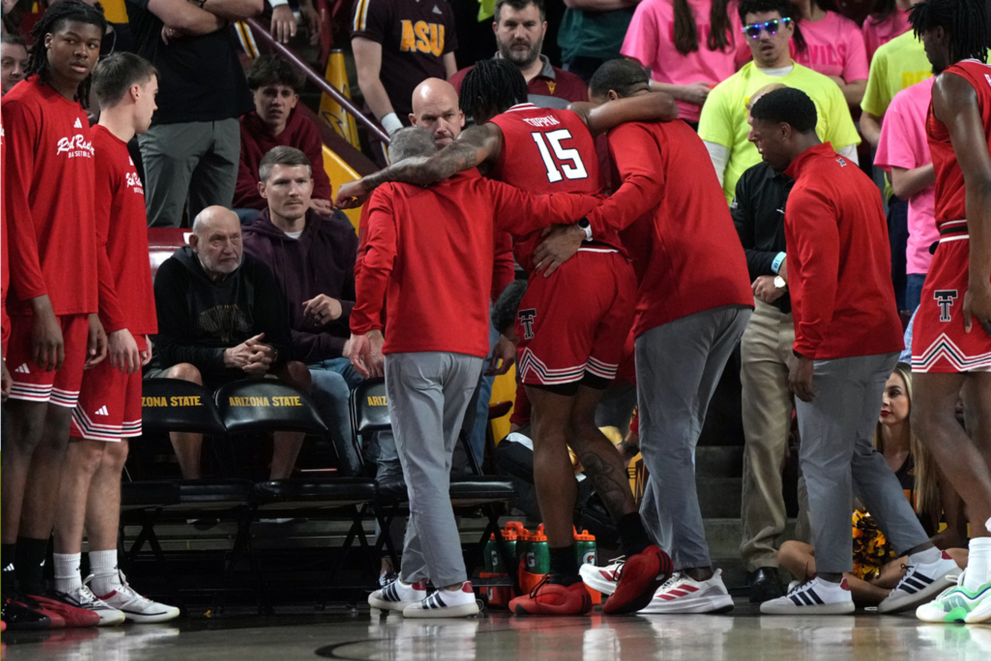 Texas Tech forward JT Toppin (15) gets helped off the court after getting injured against Arizona State