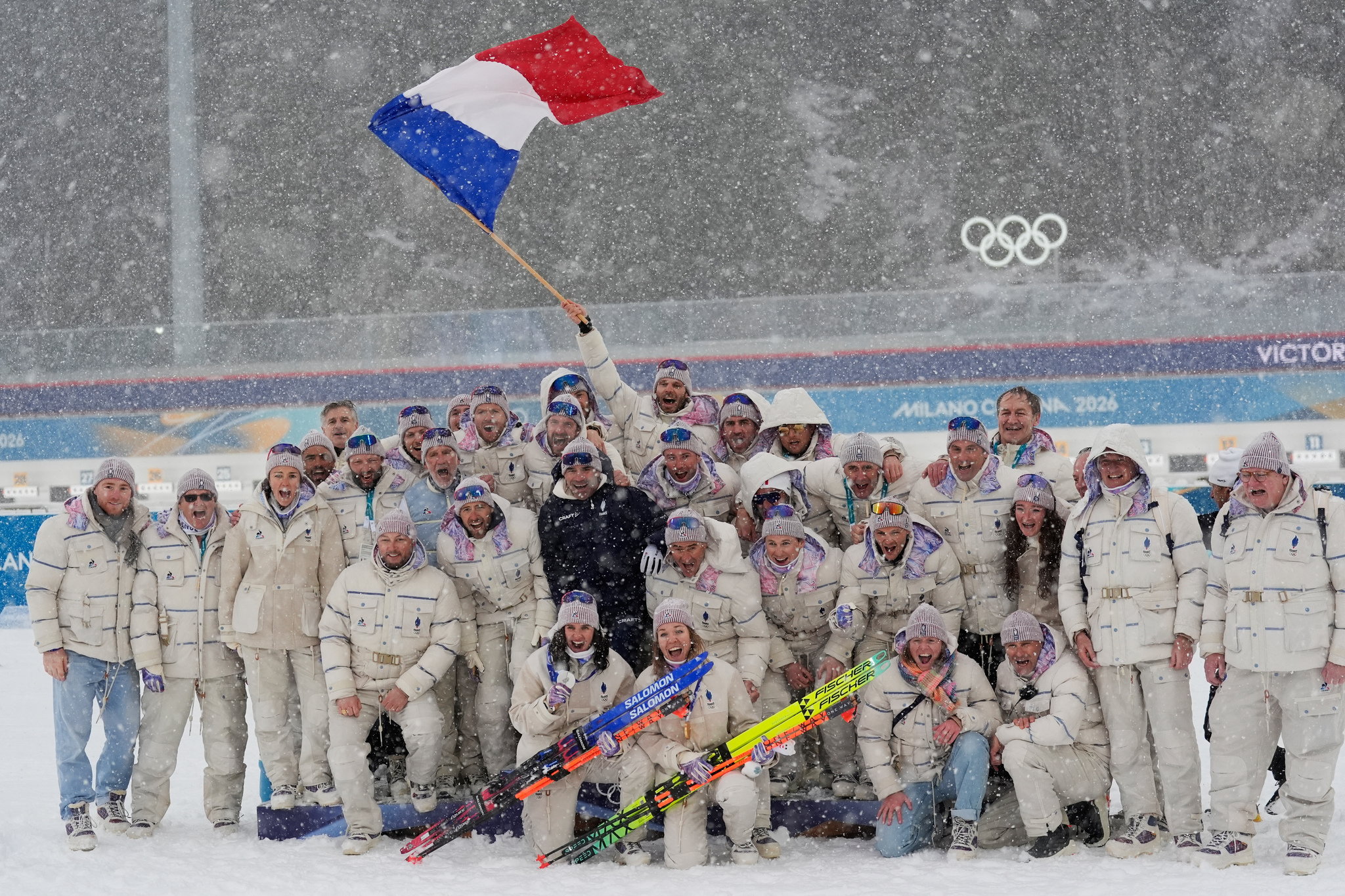 Gold medalist Oceane Michelon, of France, and silver medalist Julia Simon, of France, poses after the women's 12.5-kilometer mass start biathlon