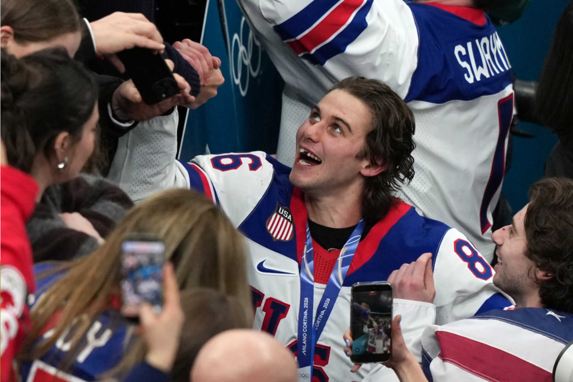 United States' Jack Hughes (86), who scored the winning overtime goal, celebrates after defeating Canada in the men's ice hockey gold medal game at the 2026 Winter Olympics in Milan
