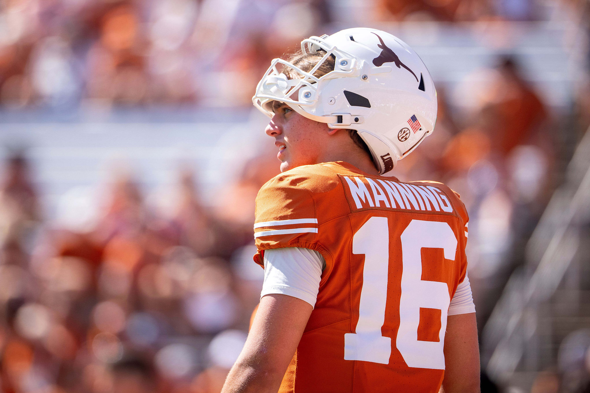 Texas quarterback Arch Manning stands on the field during an NCAA college football game against Oklahoma at the Cotton Bowl