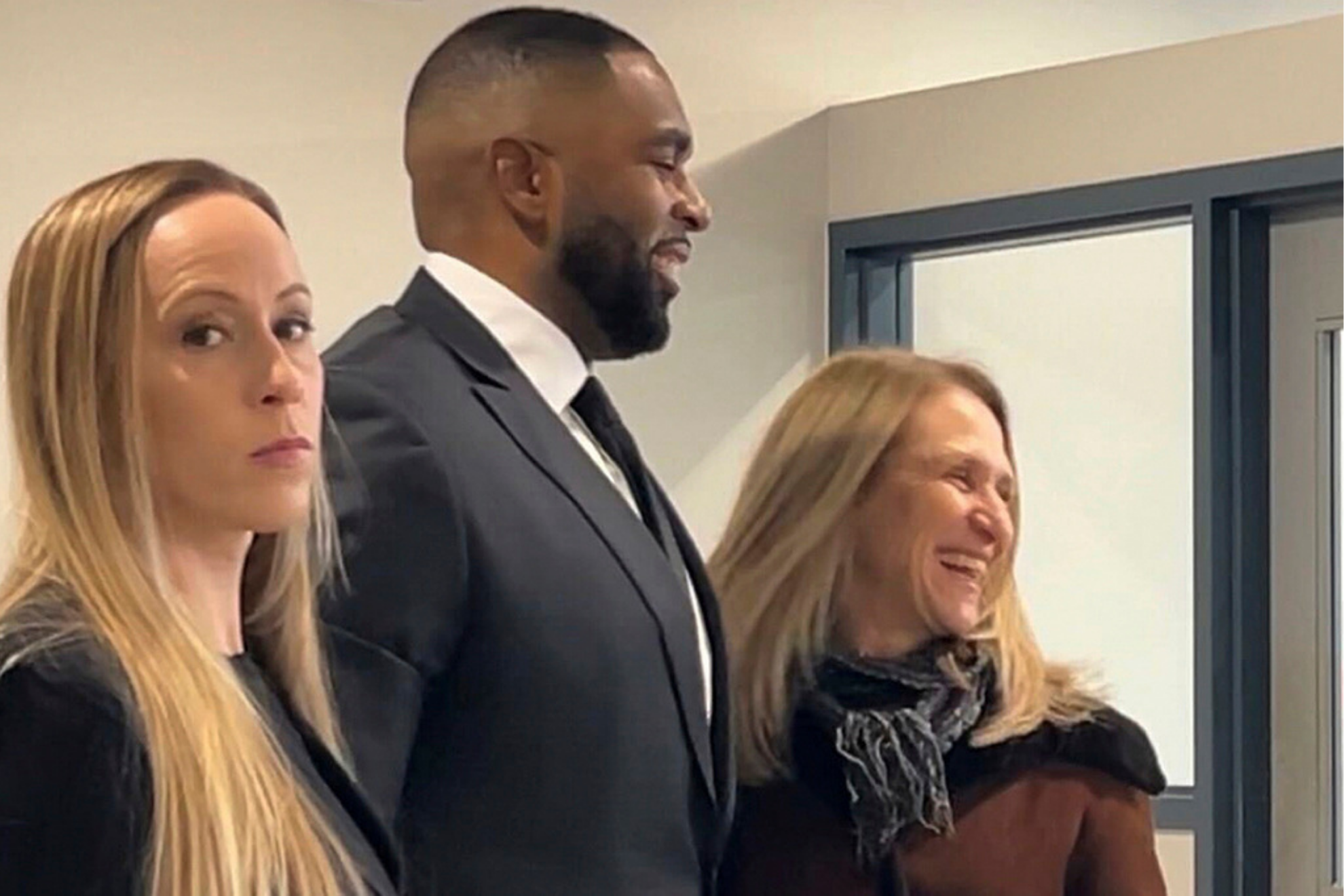 From left, Kelli Moore, Sherrone Moore and attorney Ellen Michaels arrive for the former Michigan football coach's court hearing