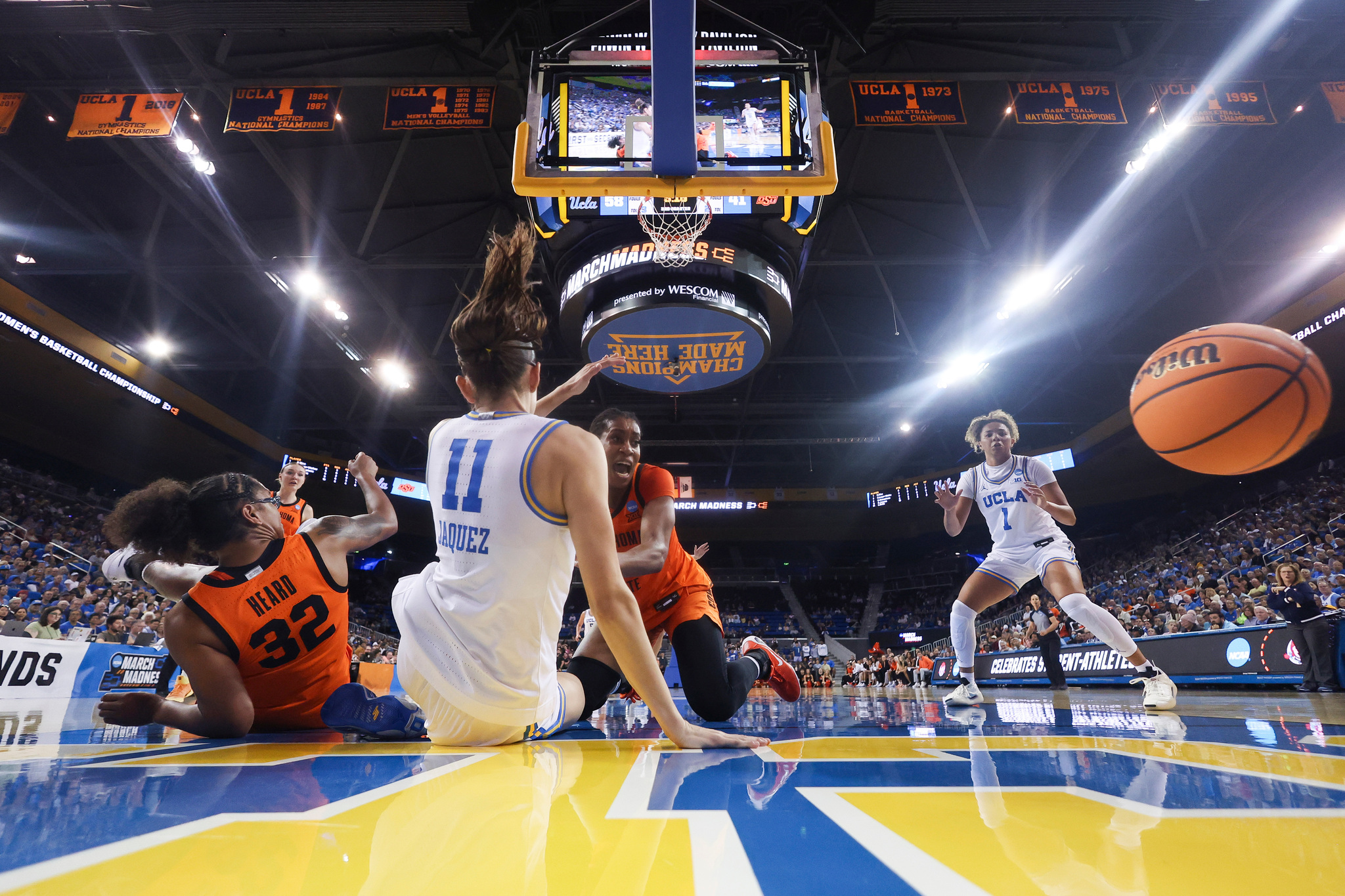 Oklahoma State guard Stailee Heard (32), UCLA forward Gabriela Jaquez (11), Oklahoma State forward Praise Egharevba, third from left.