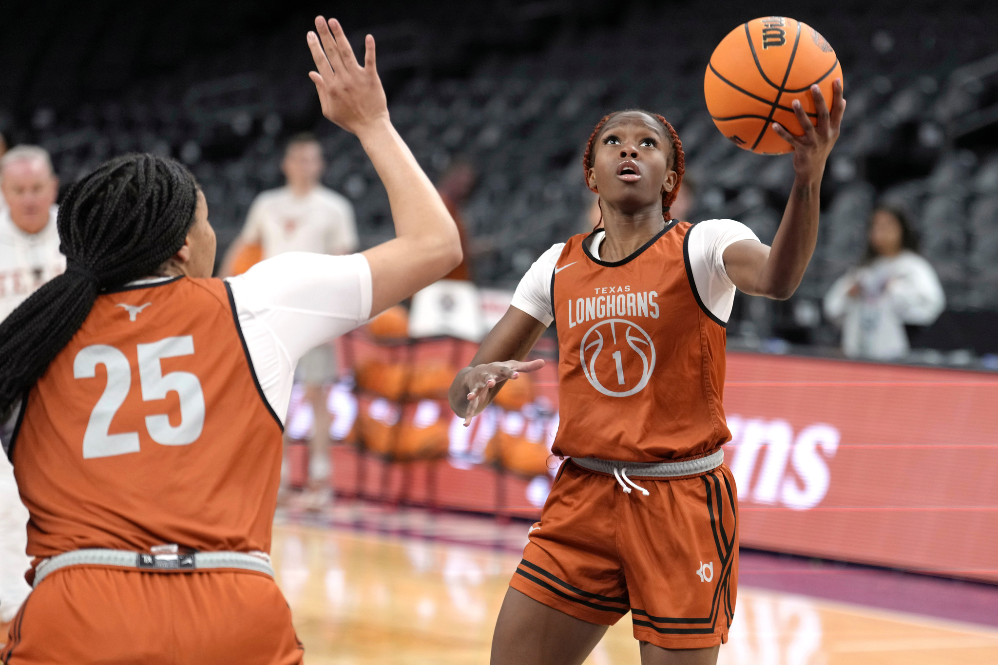Texas guard Bryanna Preston (1) goes up for a shot against Texas forward Breya Cunningham (25) during practice prior to the national semifinals Women's Final Four of the NCAA college basketball tournament,