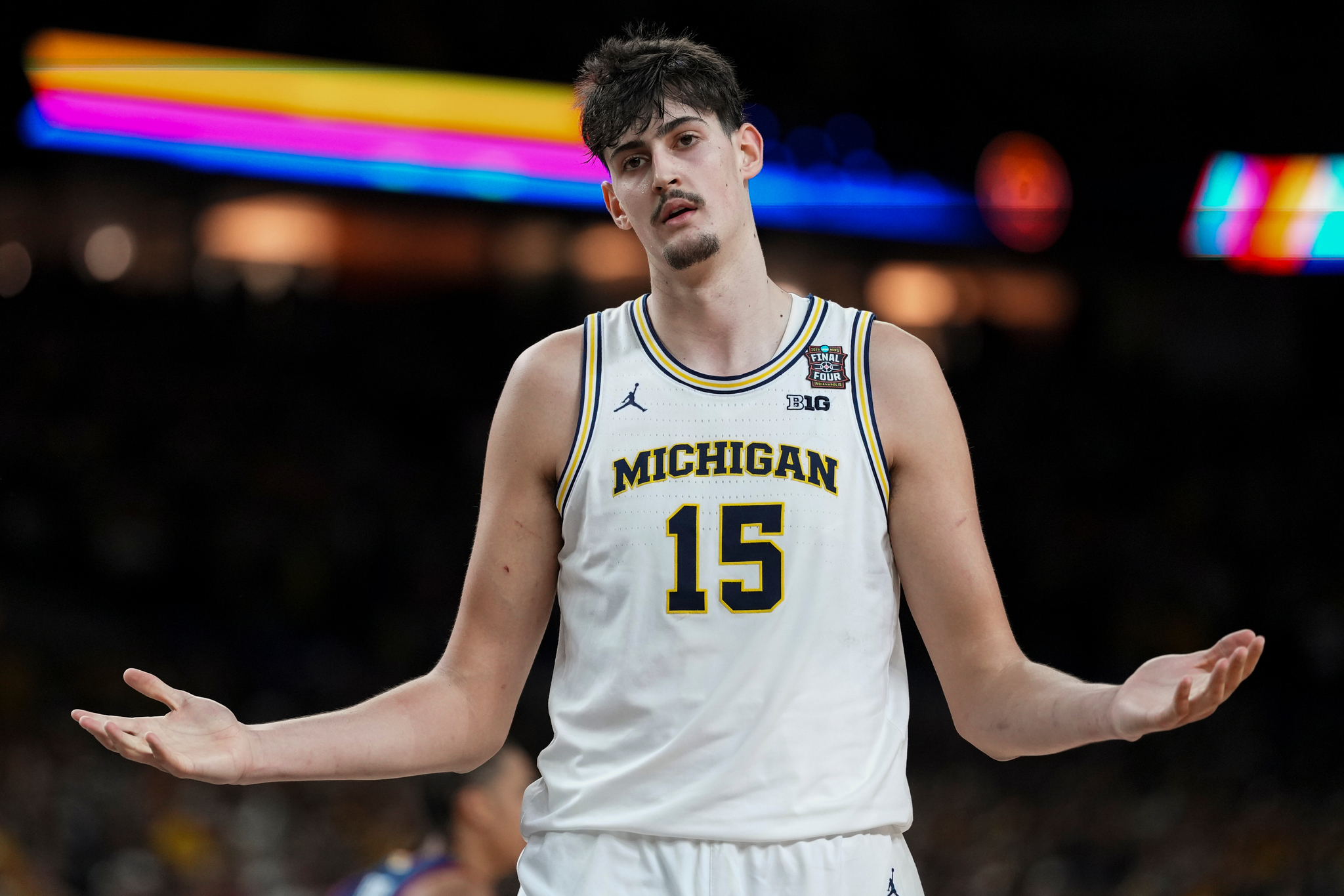 Michigan center Aday Mara reacts to a call during the first half of the NCAA college basketball tournament national championship game against UConn