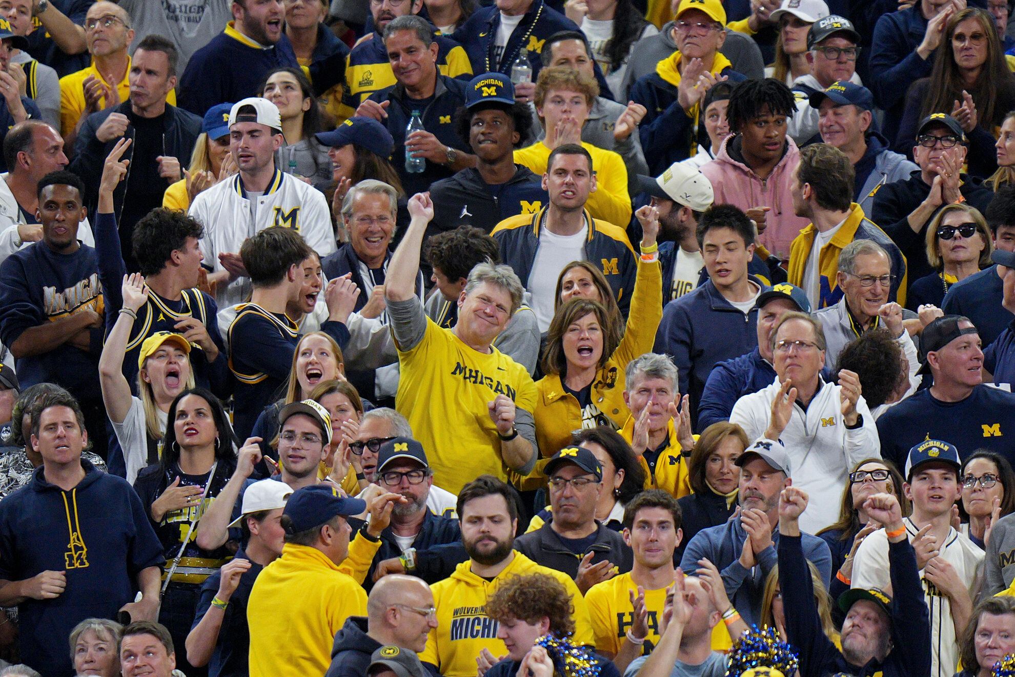 Michigan fans cheer during the second half of the NCAA college basketball tournament national championship game against UConn