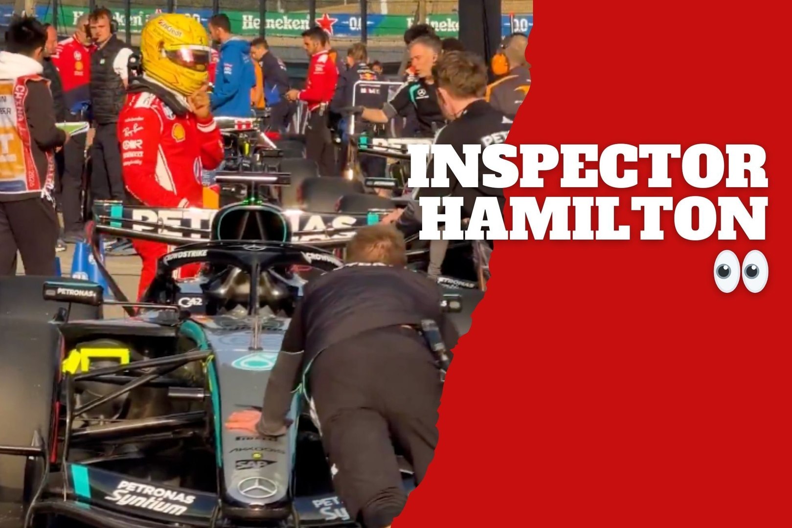 Lewis Hamilton jokingly inspects Mercedes after their dominant 1–2 finish