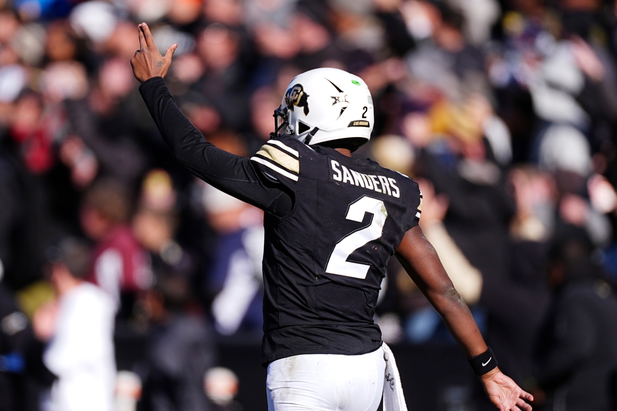 Shedeur Sanders gestures after throwing a touchdown.