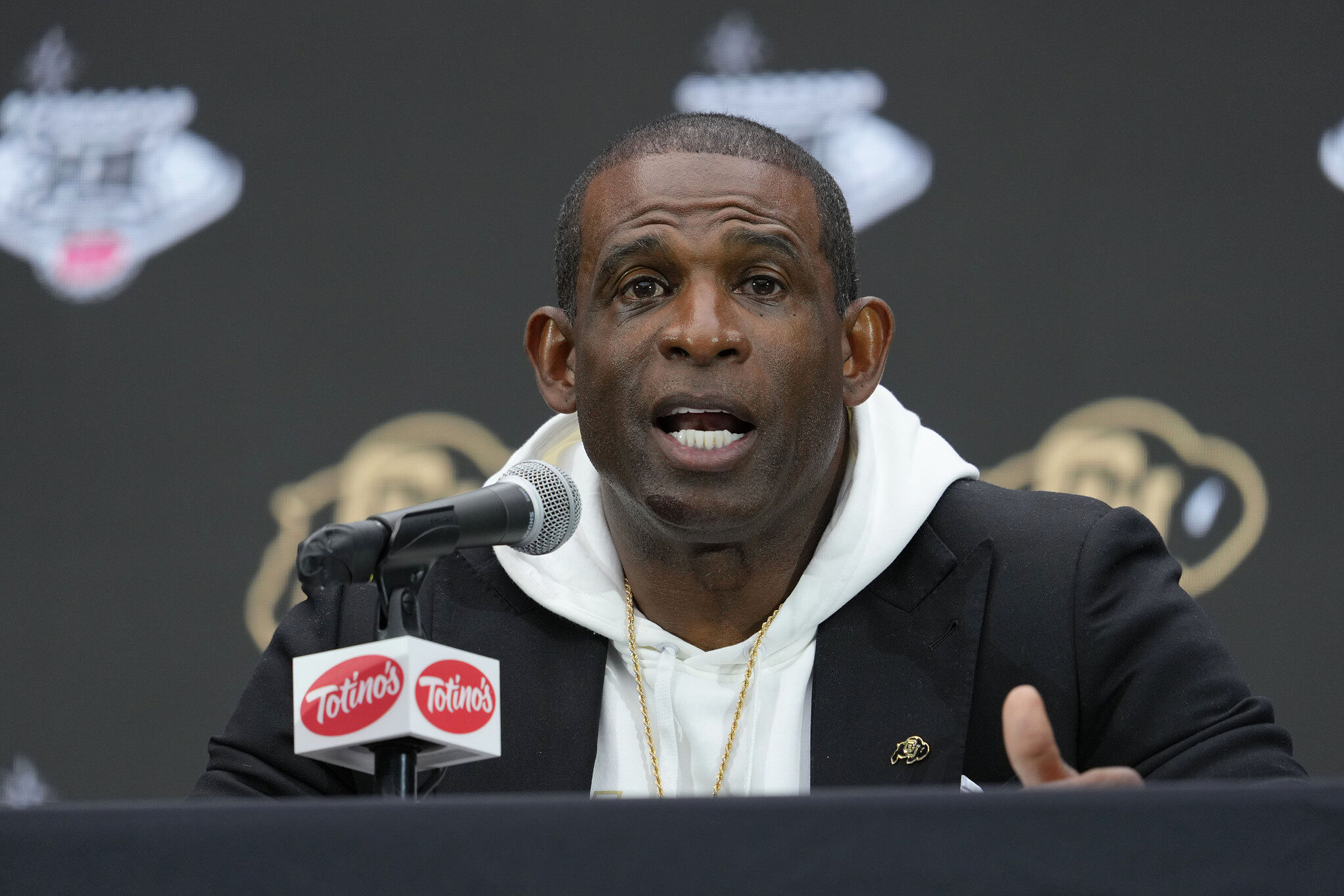 Colorado head coach Deion Sanders speaks during the Big 12 NCAA college football media days