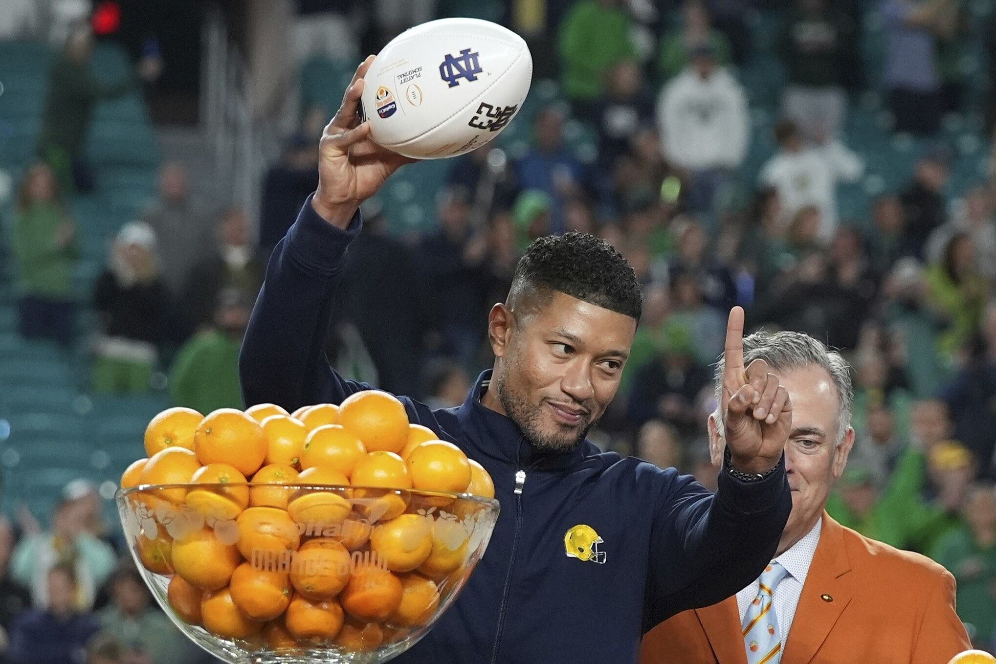 Notre Dame head coach Marcus Freeman gestures to the team after winning the Orange Bowl