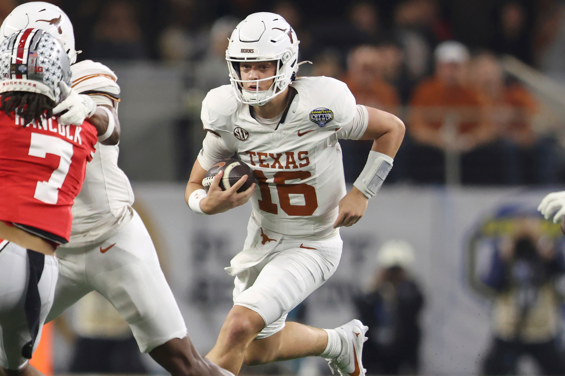 Arch Manning runs for a first down during the Cotton Bowl between Texas and Ohio State.