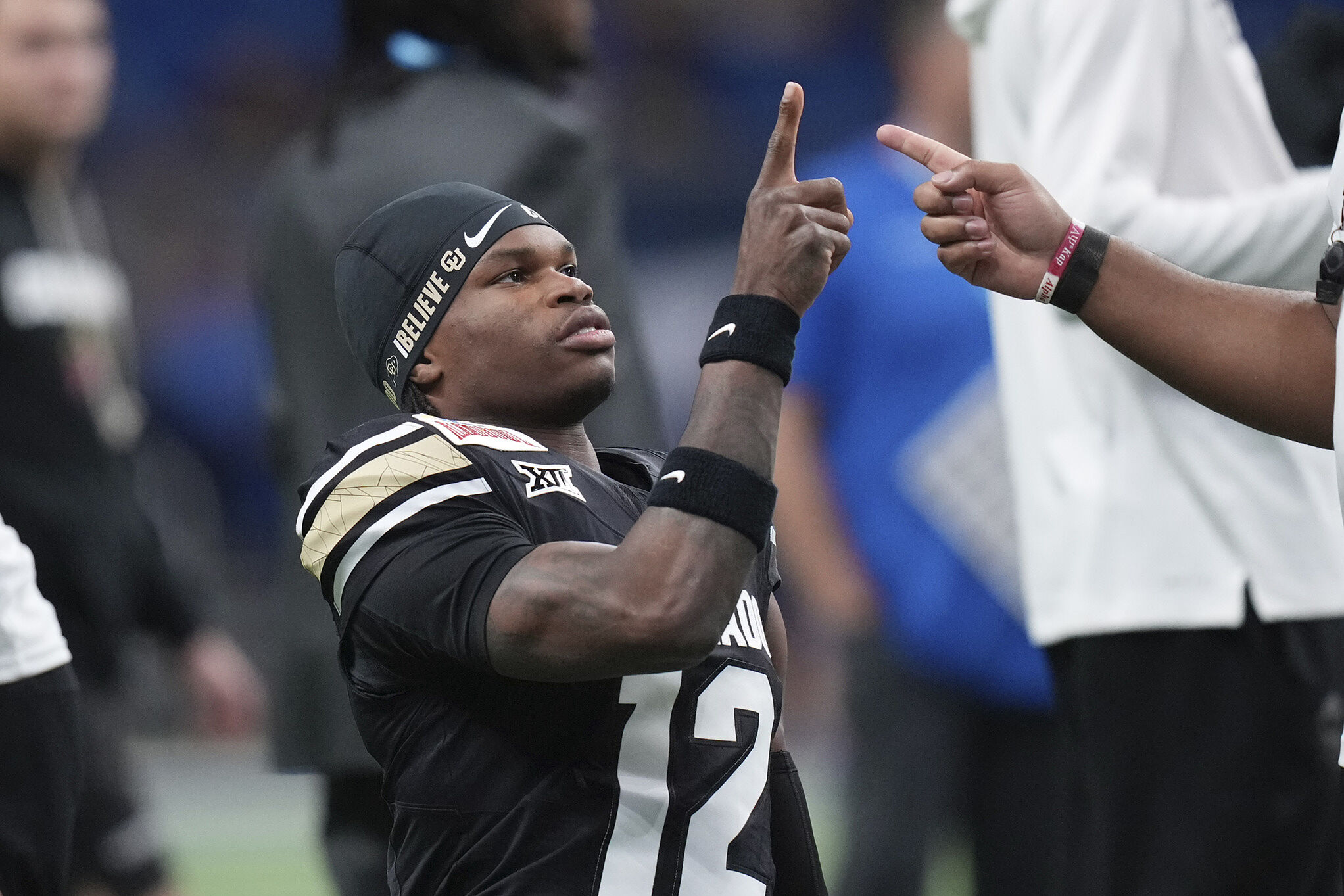 Colorado wide receiver Travis Hunter (12) warms up for the Alamo Bowl against BYU