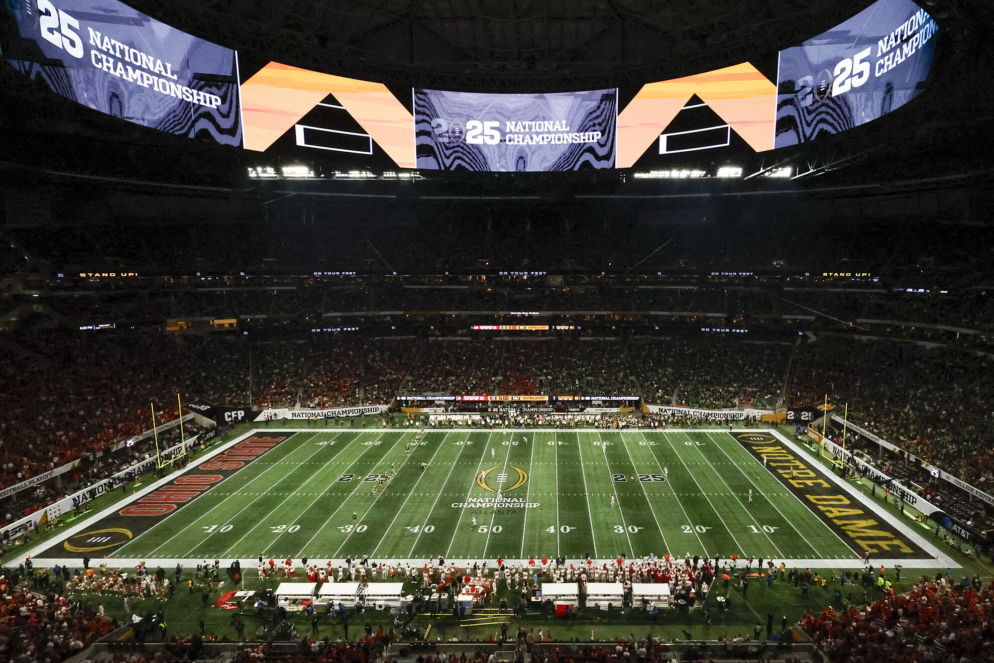Fans watch during second half of the College Football Playoff national championship game between Ohio State and Notre Dame Monday, Jan. 20, 2025, in Atlanta. (AP Photo/Butch Dill)