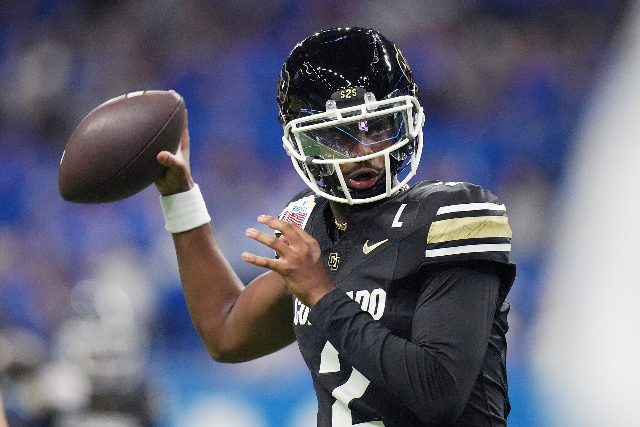 Colorado quarterback Shedeur Sanders (2) warms up for the Alamo Bowl against BYU