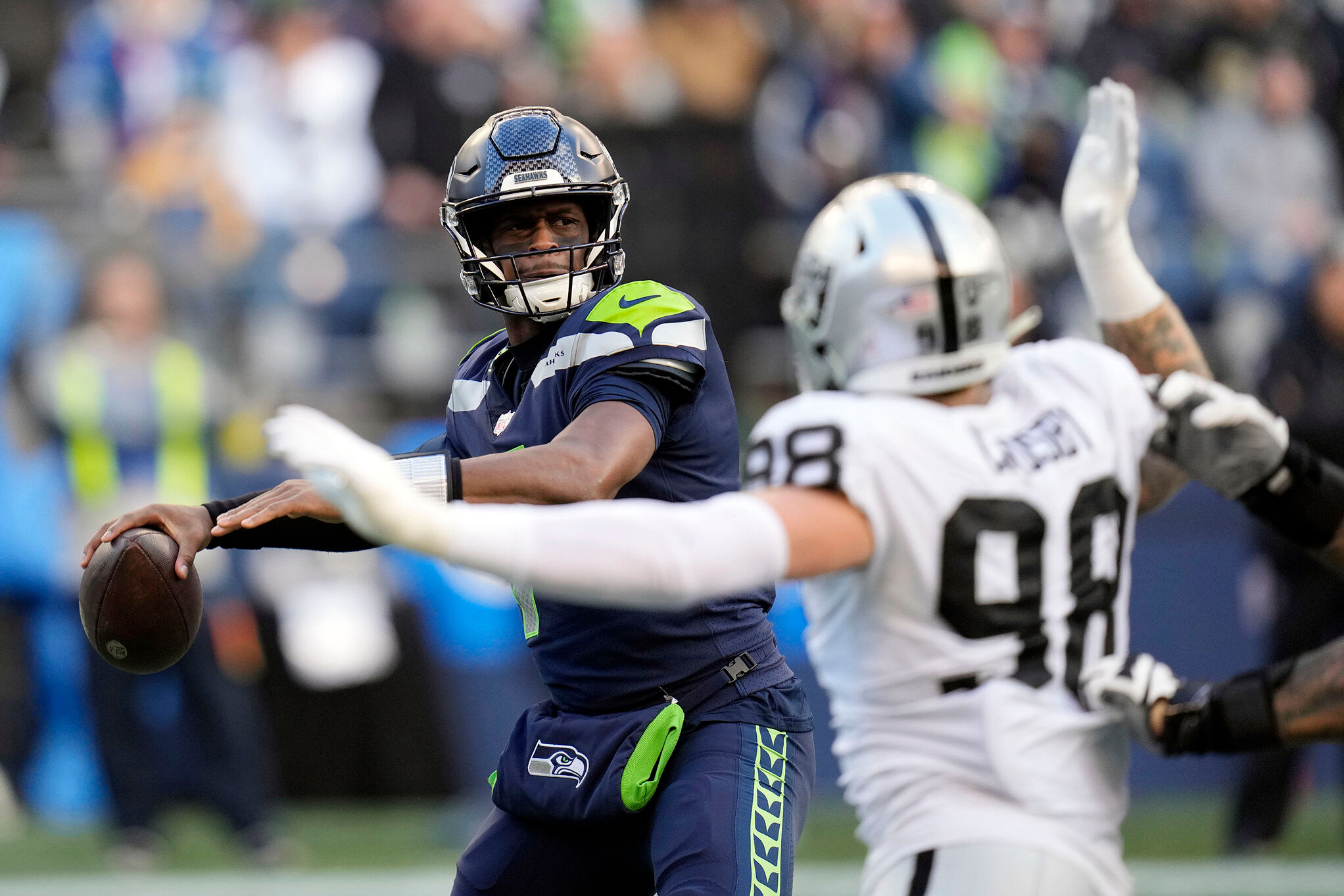 Seattle Seahawks quarterback Geno Smith throws against the Las Vegas Raiders