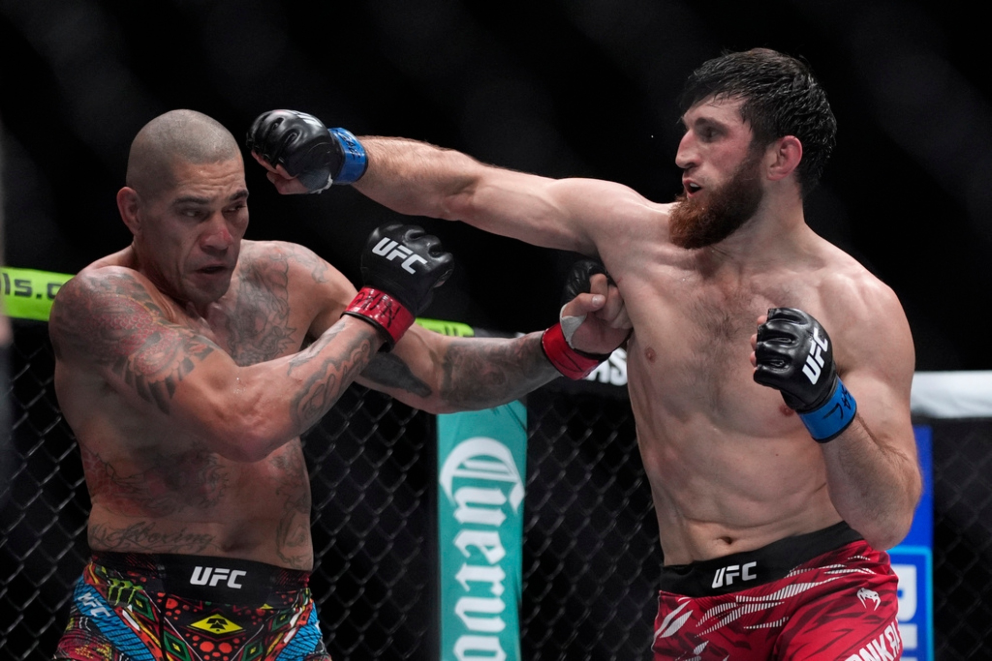Alex Pereira, left, fights Magomed Ankalaev during a UFC 313 mixed martial arts light heavyweight title.