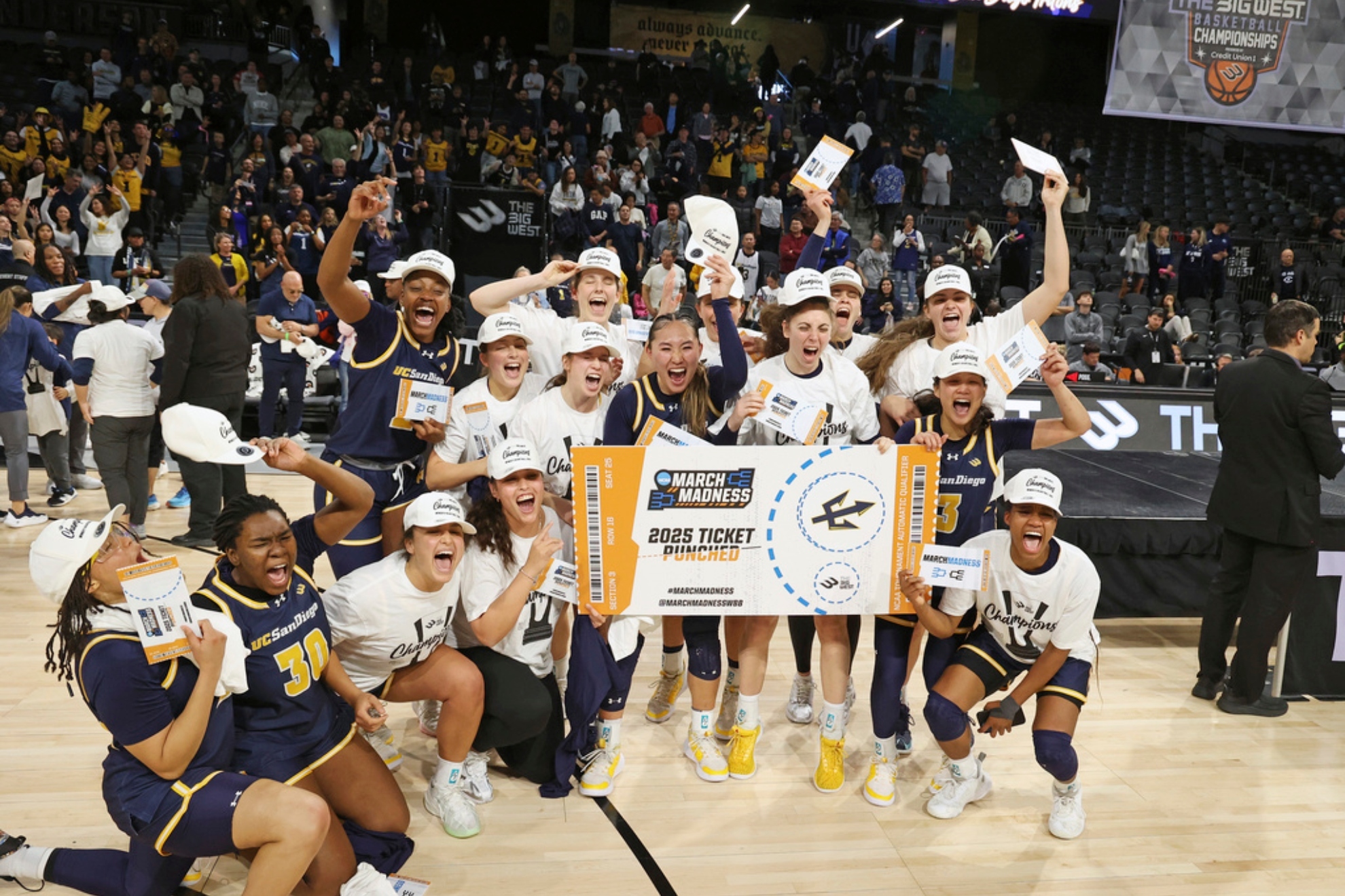 UC San Diego players celebrate after defeating UC Davis in an NCAA college basketball game in the championship of the Big West Conference.