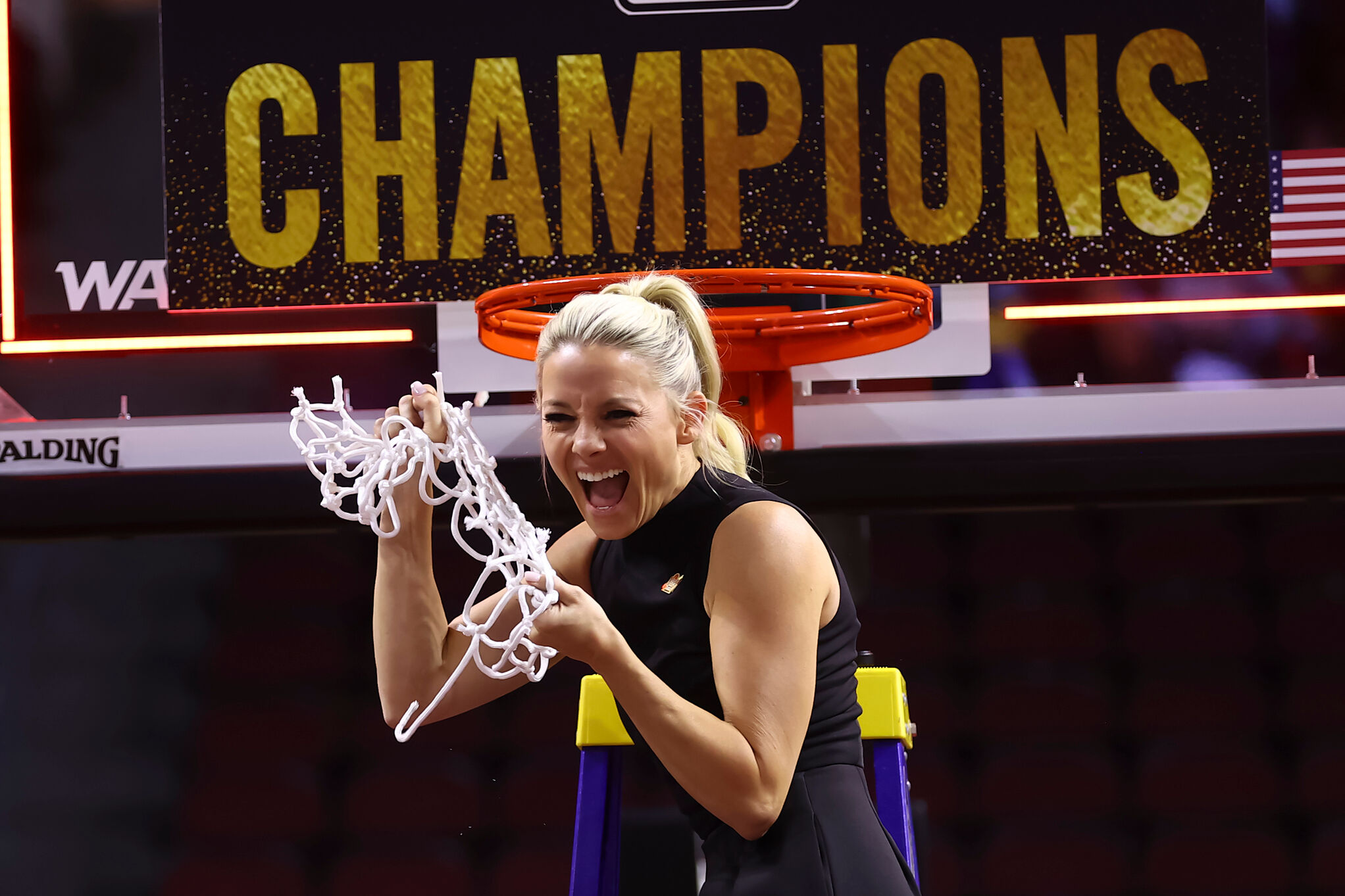 Former Grand Canyon head coach Molly Miller cuts down the net after the team's victory in the championship of the Western Athletic Conference tournament