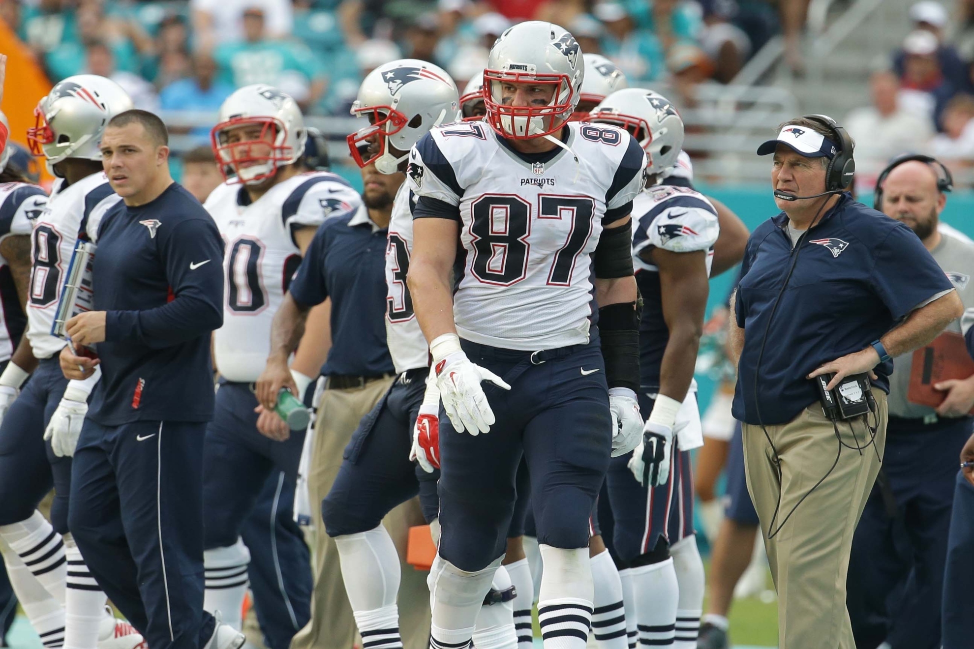 Rob Gronkowski and head coach Bill Belichick walk the sidelines during the second half of an NFL football game in 2016.
