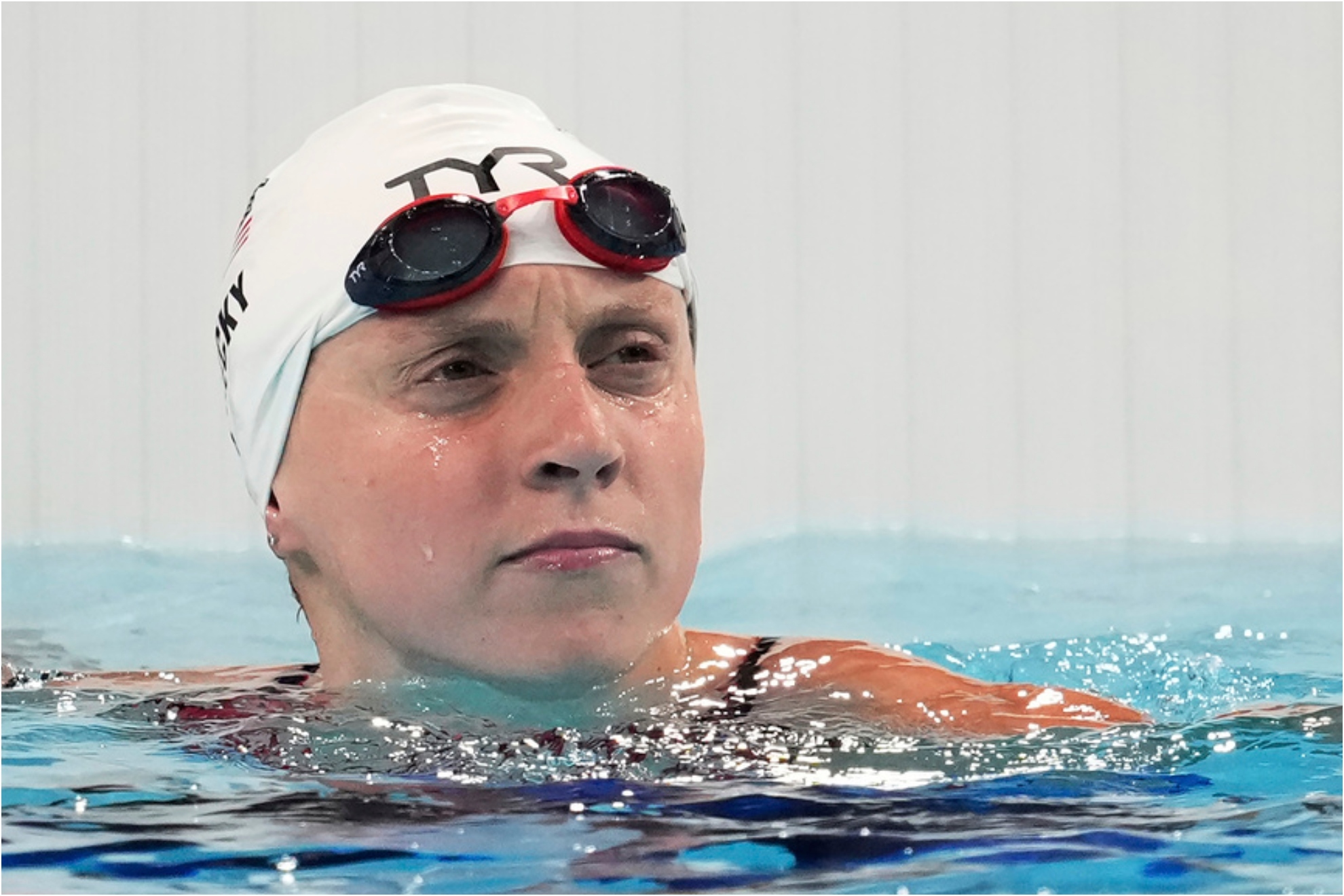United States' Katie Ledecky looks at the board after winning a women's 800-meter freestyle heat at the Summer Olympics.