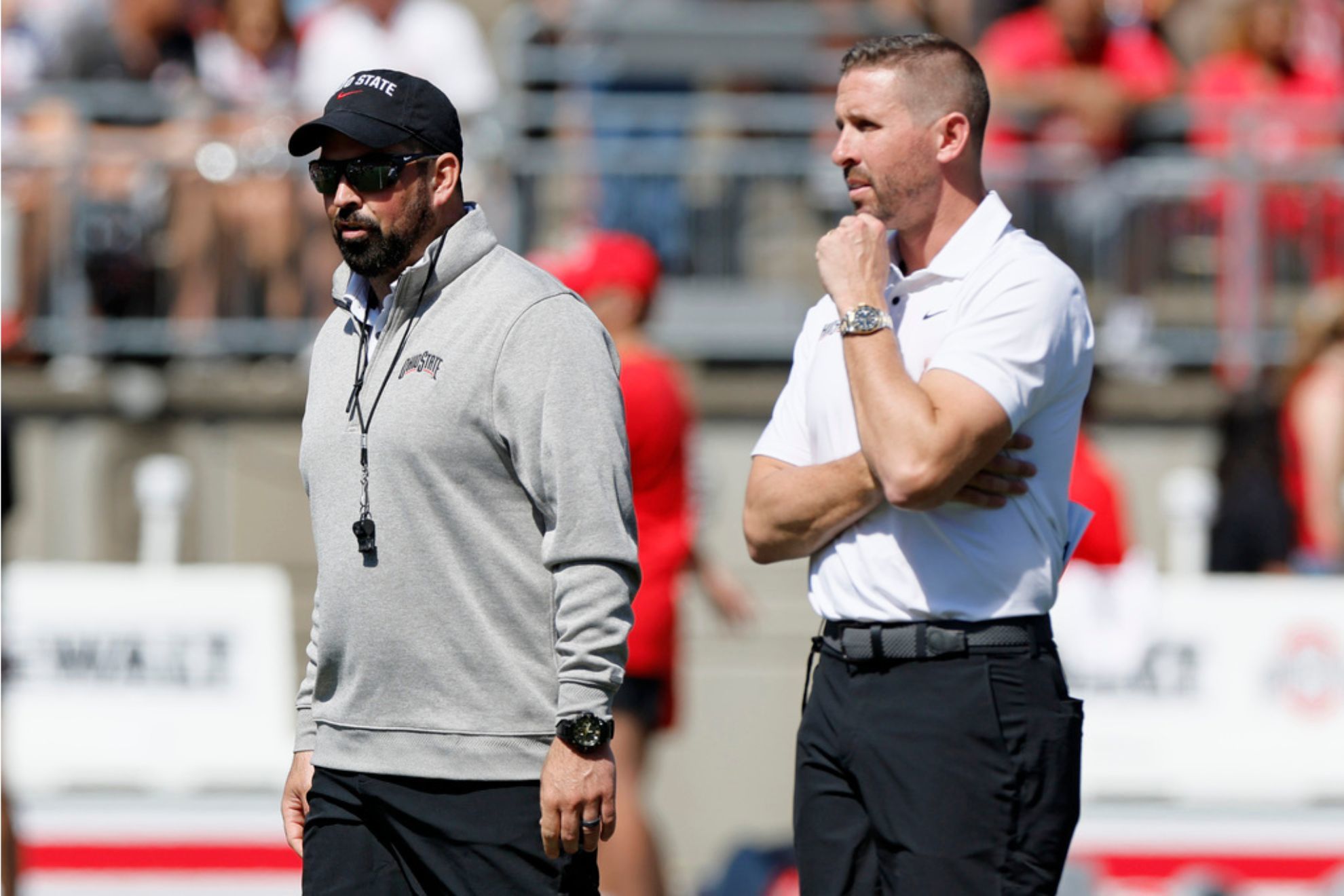 Ohio State head coach Ryan Day, left, and offensive coordinator Brian Hartline watch their team during their spring NCAA college football game