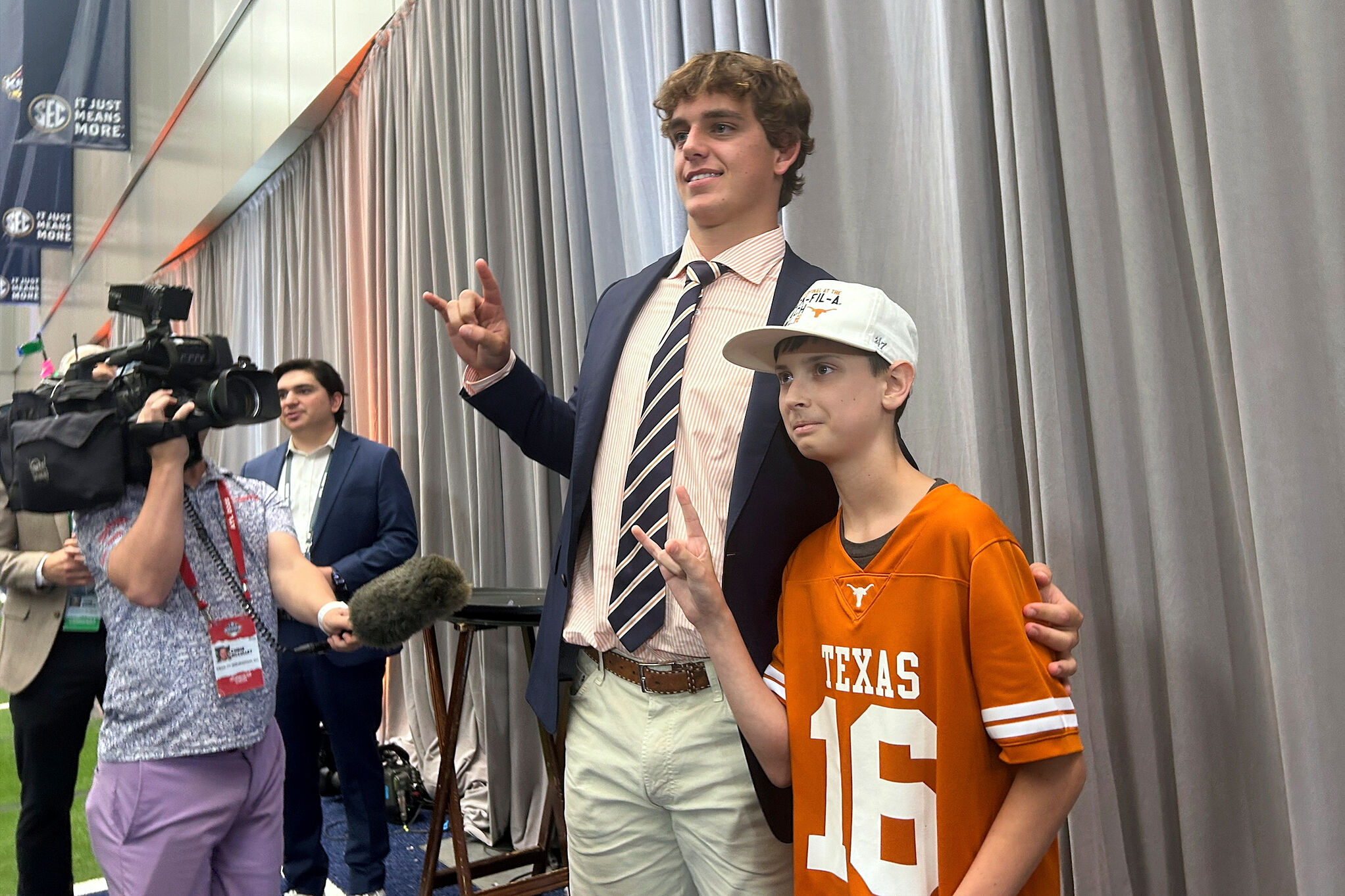 Texas quarterback Arch Manning meets super-fan Connor Petroziello, 13, at SEC Media Days in Atlanta
