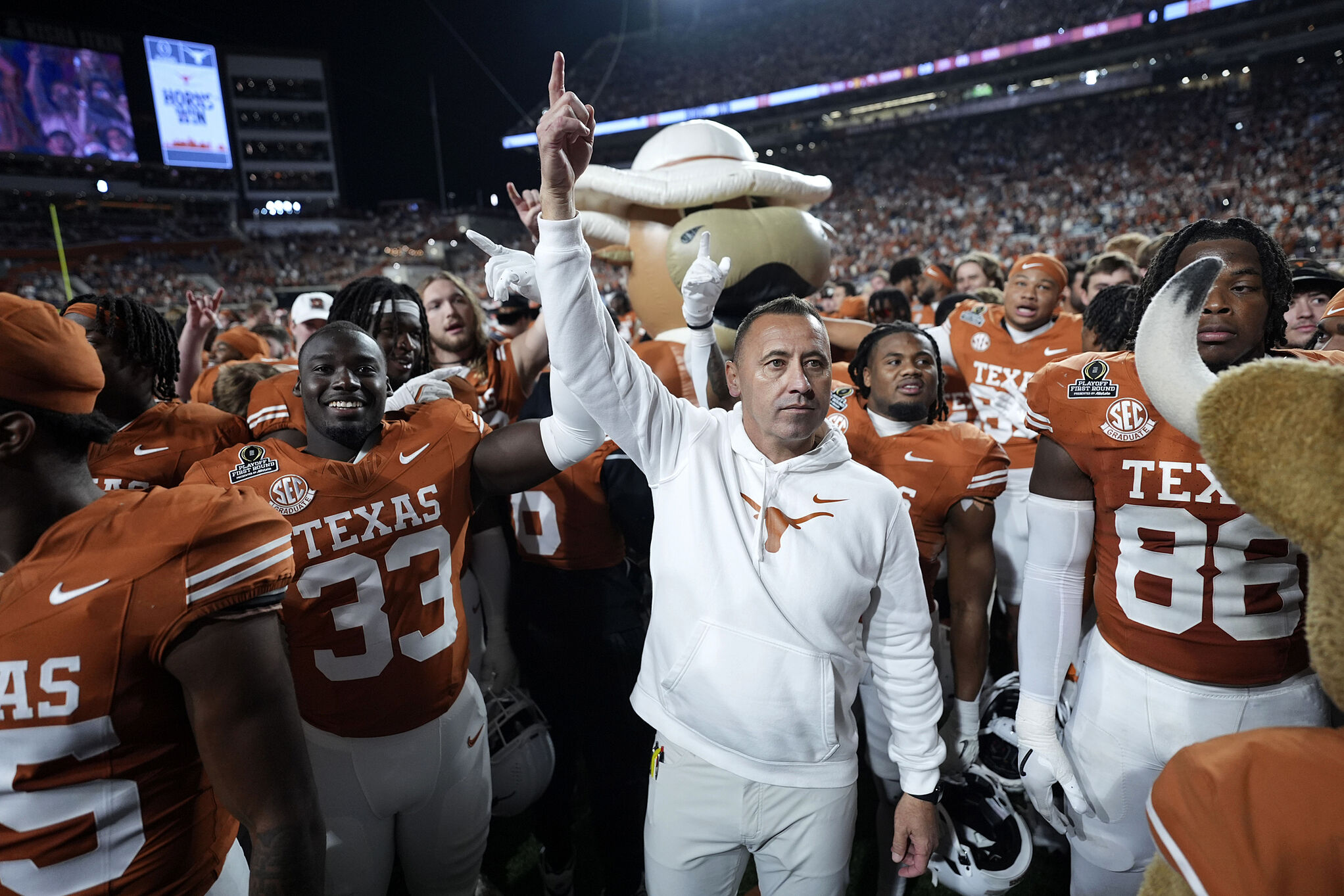 Texas head coach Steve Sarkisian celebrates with his team after a first round game against Clemson in the College Football Playoff