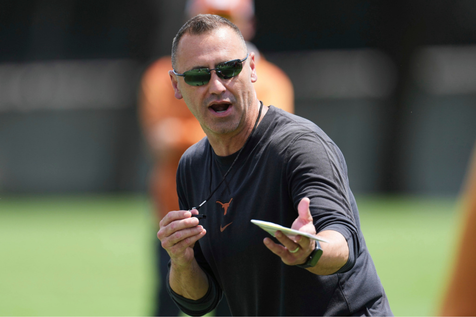 Texas head coach Steve Sarkisian gives instruction