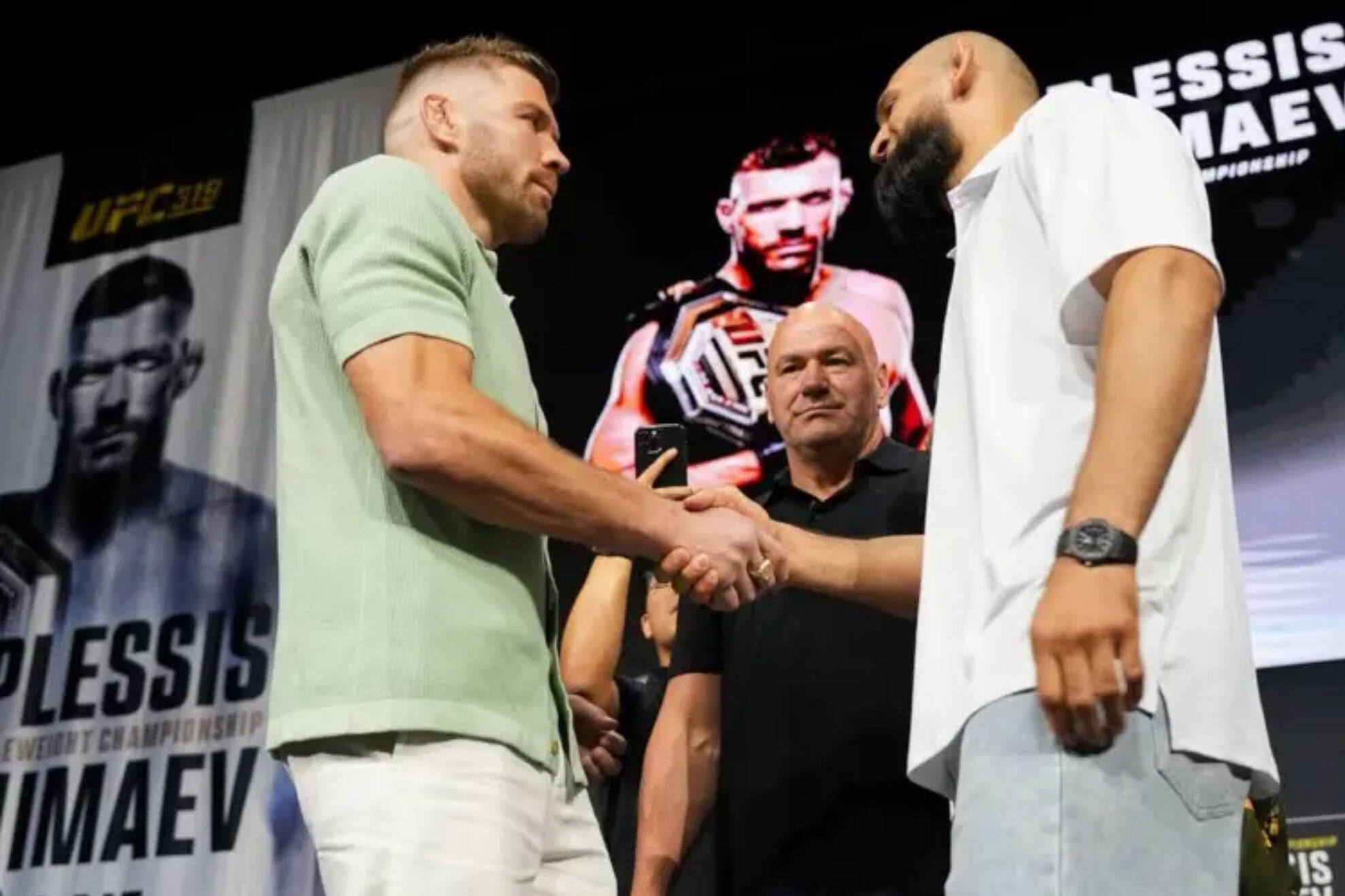 Dricus Du Plessis and Khamzat Chimaev during the first face-off at UFC 319.