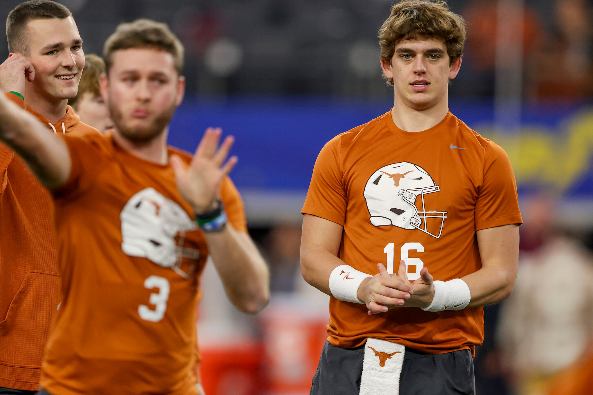 Texas quarterback Arch Manning (16) warms up alongside quarterback Quinn Ewers (3) prior to the Cotton Bowl College Football Playoff semifinal