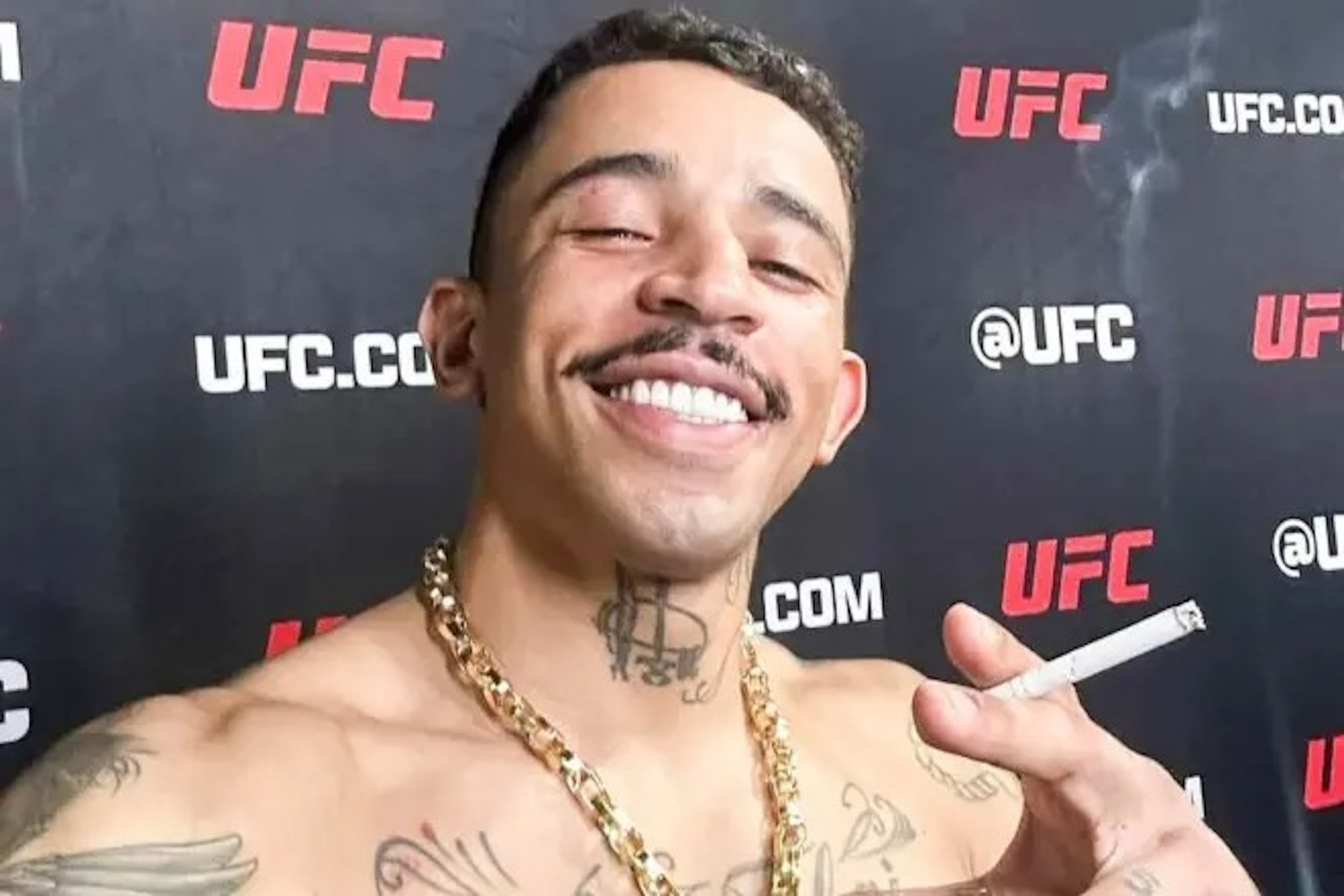 Carlos Prates posing with a cigar after UFC 319.