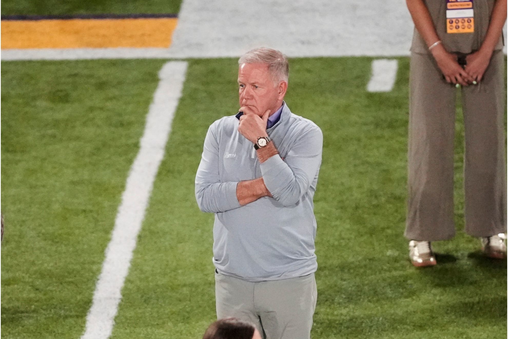 LSU head coach Brian Kelly watches drills during the school's NFL football pro day in Baton Rouge
