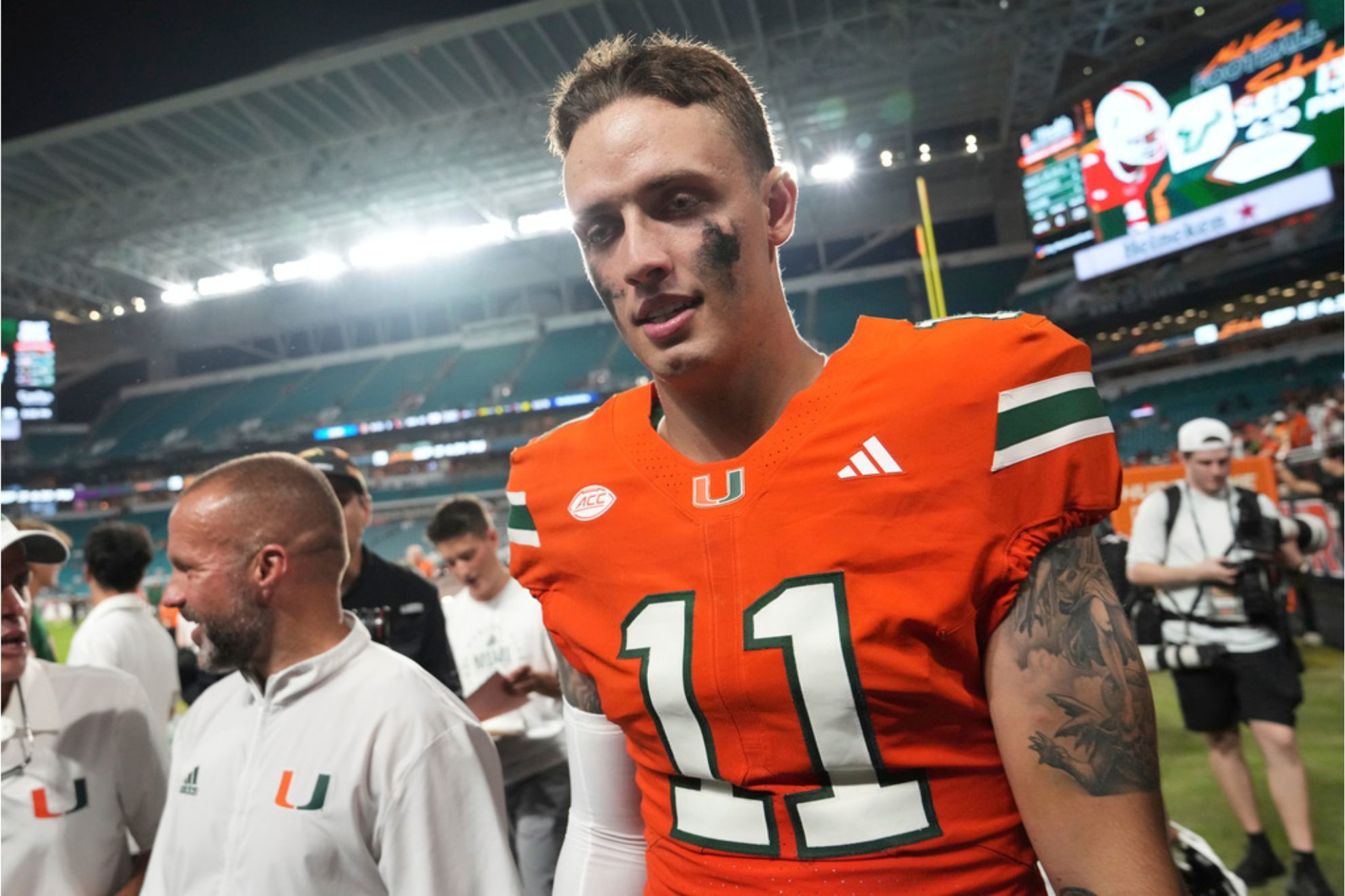 Miami quarterback Carson Beck walks off the field after defeating Bethune-Cookman in an NCAA college football game