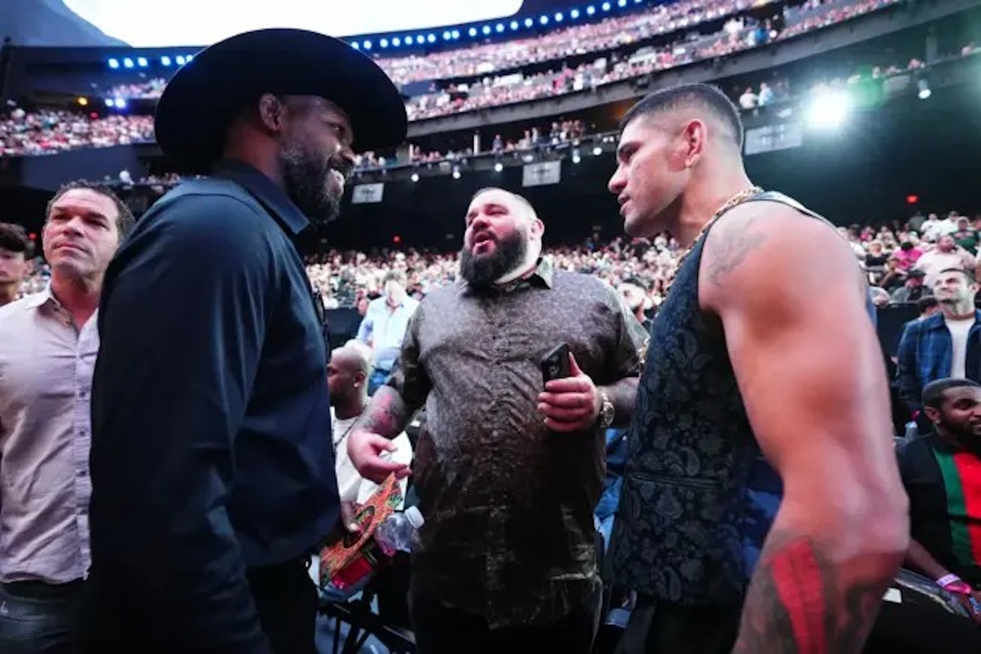 Jon Jones and Alex Pereira talking during a UFC event.
