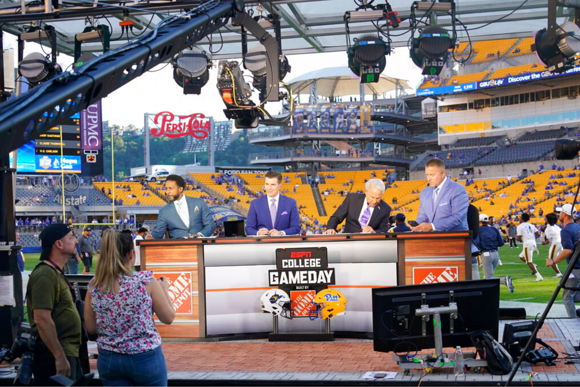 ESPN broadcasters, left to right, Desmond Howard, Rece Davis, Lee Corso, and Kirk Herbstreit, prepare for their show of College Game day