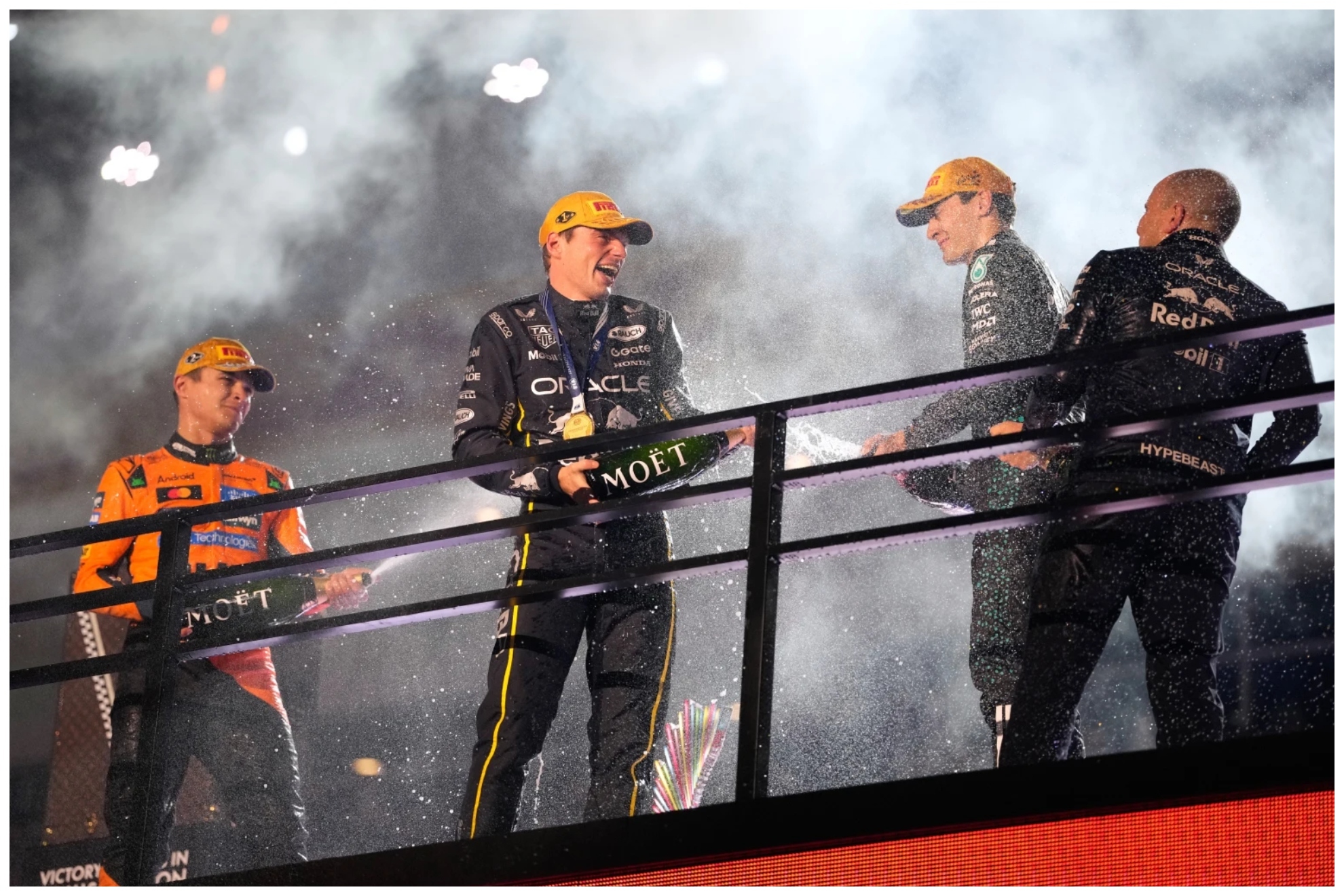 From left, second place finisher McLaren driver Lando Norris of Great Britain, first place finisher Red Bull driver Max Verstappen of the Netherlands, and third place finisher Mercedes driver George Russell of Great Britain celebrate after the Formula One Las Vegas Grand Prix auto race, Saturday, Nov. 22, 2025 in Las Vegas. (AP Photo/John Locher)