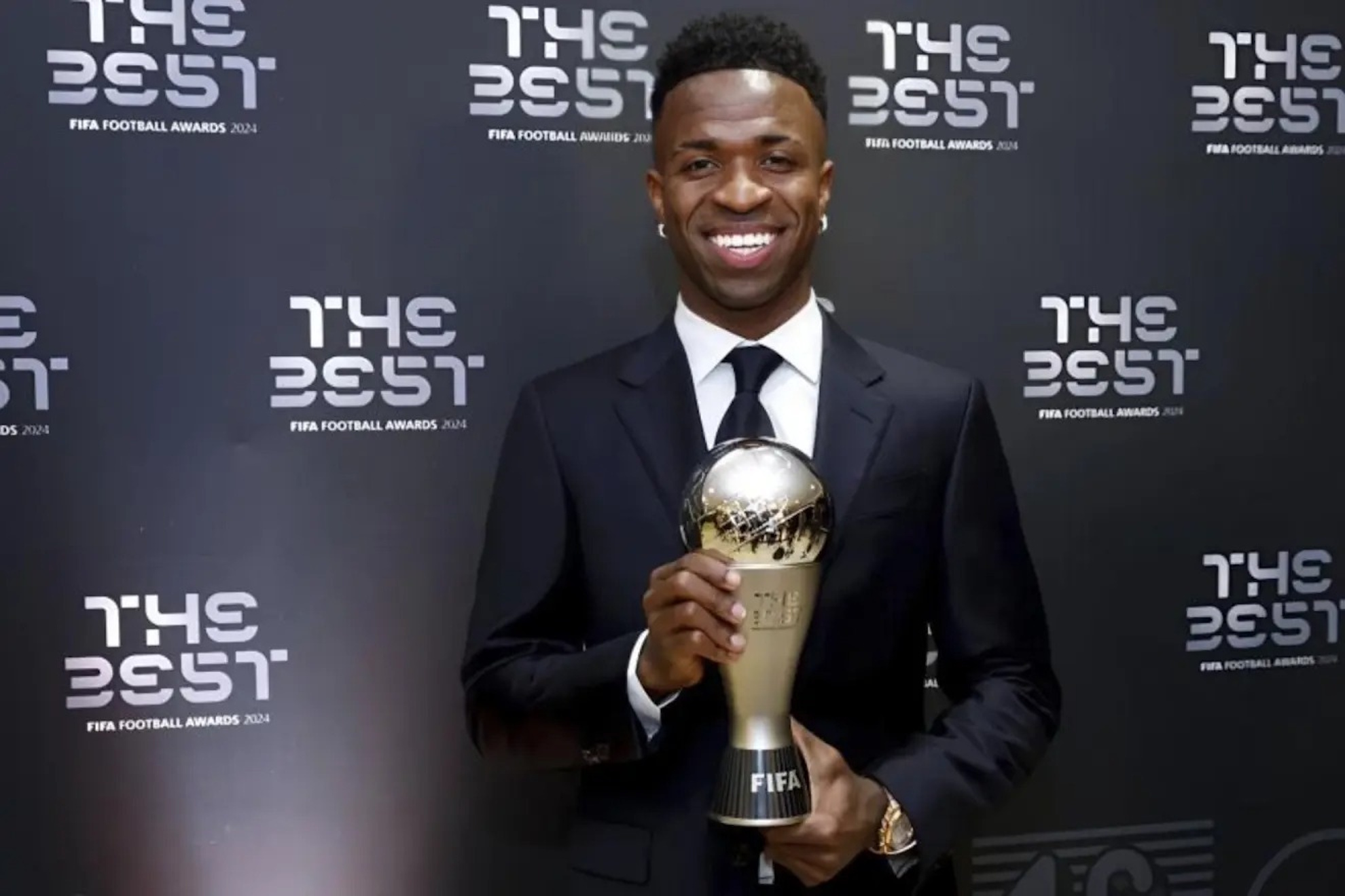 Vinicius poses with the The Best trophy he won last year.
