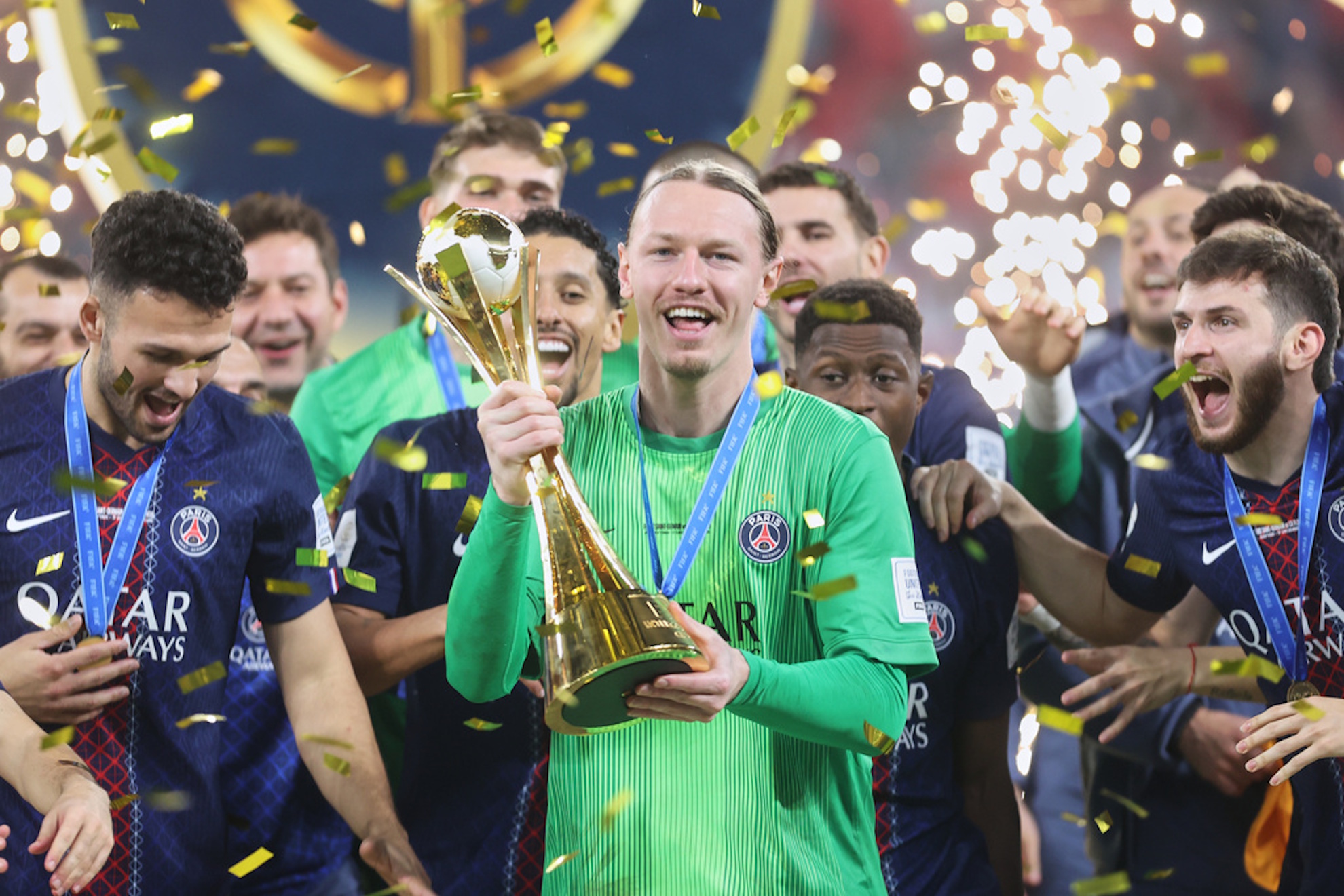 PSG's goalkeeper Matvey Safonov holds the trophy after winning the FIFA Intercontinental Cup final
