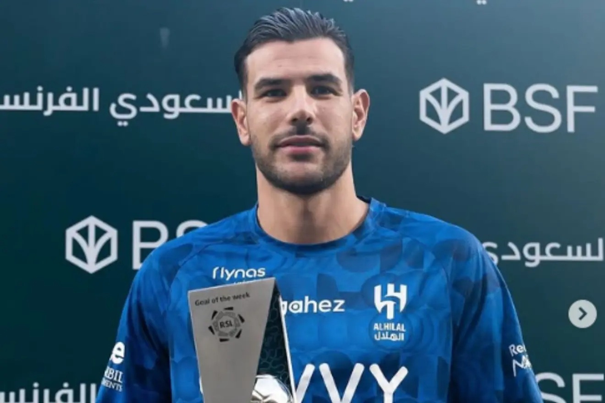 Theo Hernandez poses with the 'Best Goal' award.