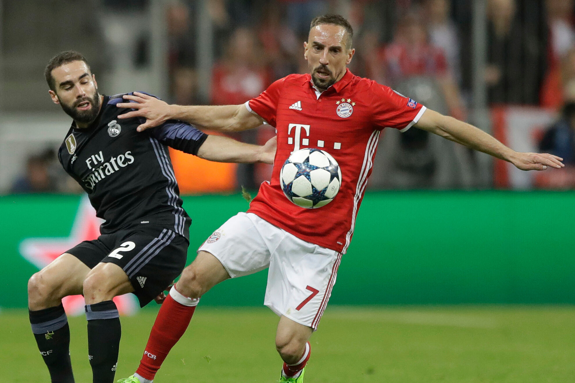 Real Madrid's Dani Carvajal fights for the ball against Bayern's Franck Ribery during the Champions League quarterfinal first leg soccer match between FC Bayern Munich and Real Madrid, in Munich, Germany, Wednesday, April 12, 2017.
