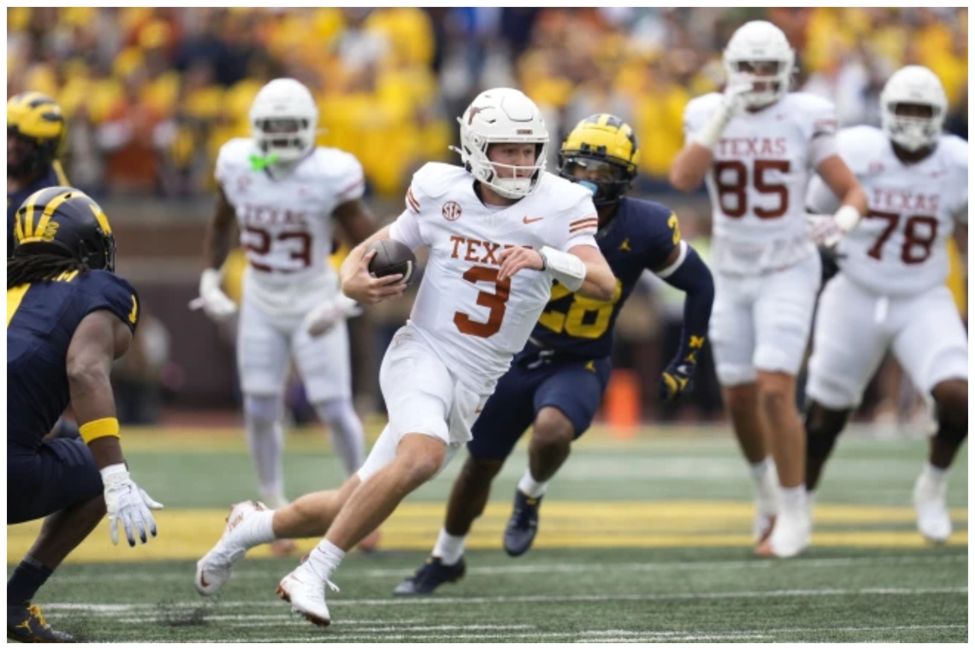 Texas quarterback Quinn Ewers (3) runs the ball against Michigan in the first half of an NCAA college football game in Ann Arbor,