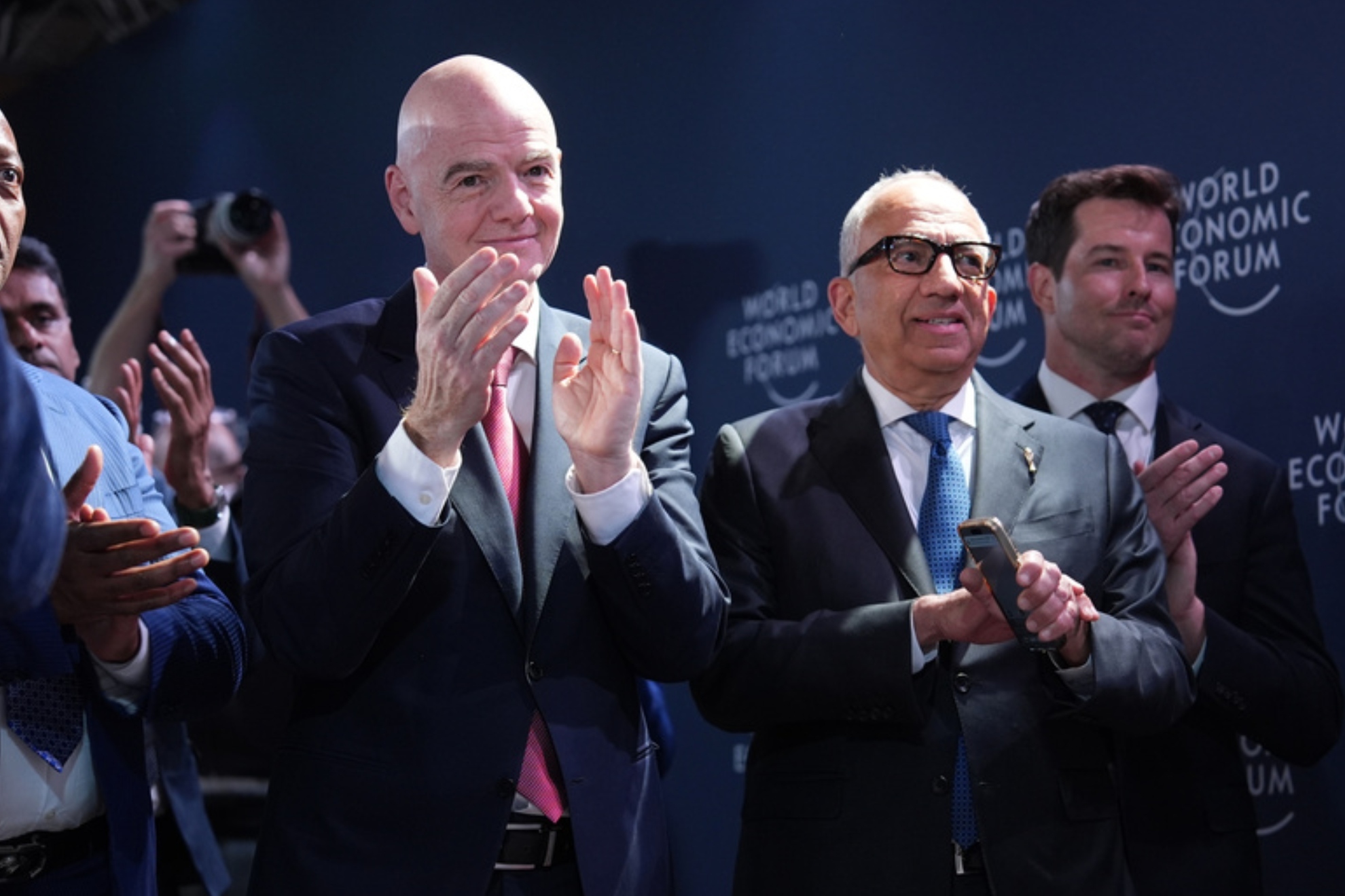 FIFA President Gianni Infantino, center left, applauds.