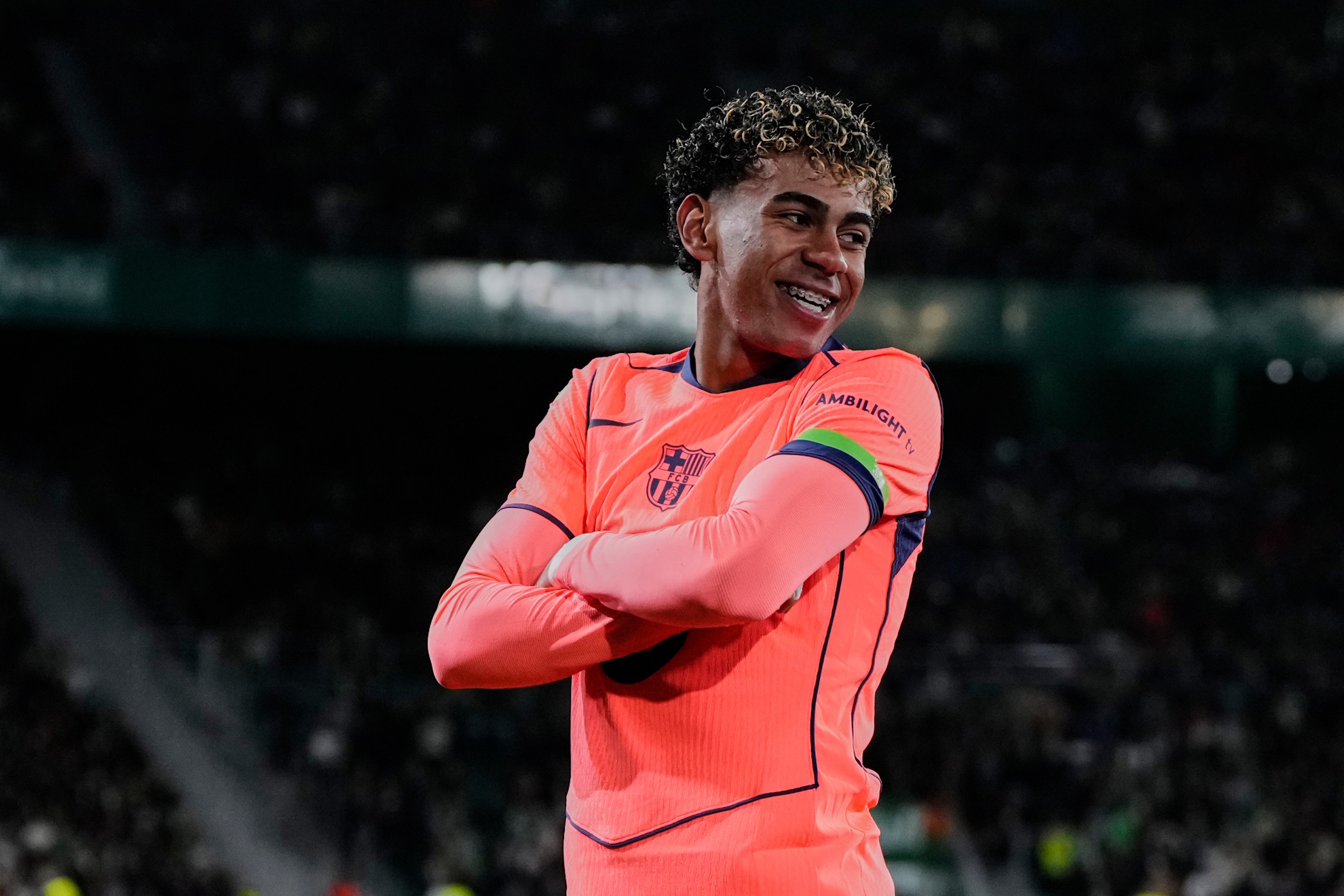 Barcelona's Lamine Yamal celebrates after scoring the opening goal.