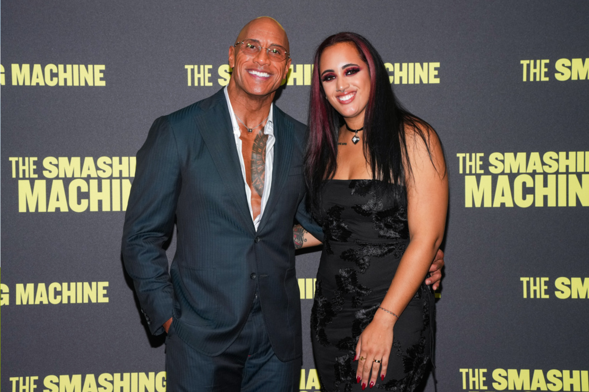Dwayne Johnson, left, and Ava Raine pose for photographers