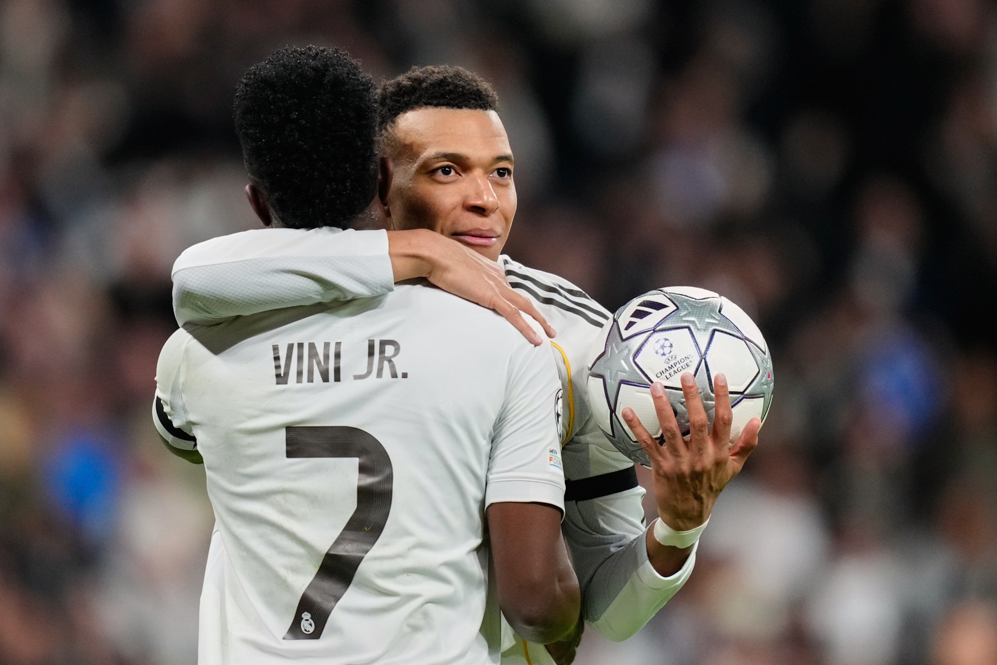 Real Madrid's Kylian Mbappe celebrates with Vinicius Junior.