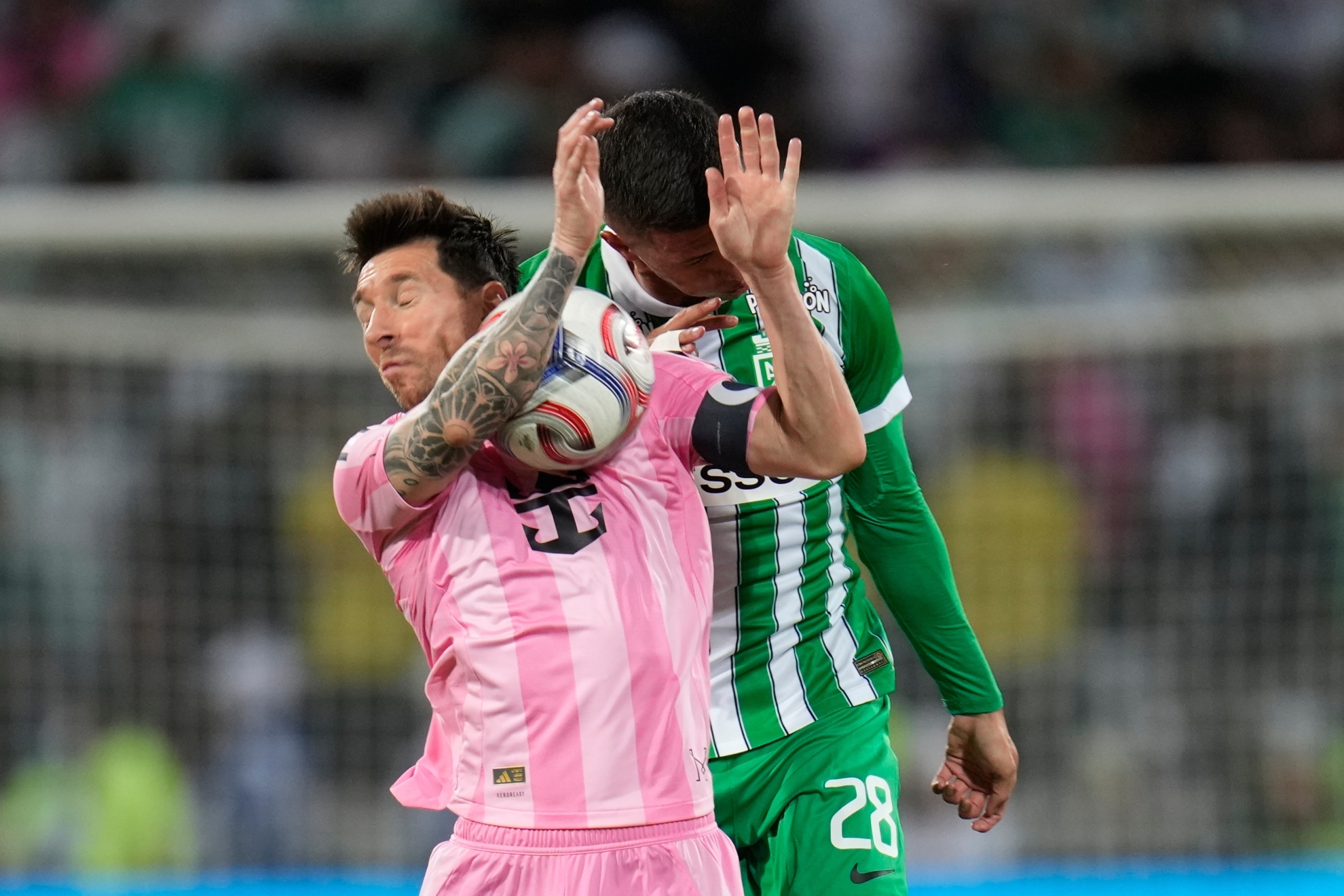 Inter Miami's Lionel Messi, left, and Simon Garcia of Colombia's Atletico Nacional.