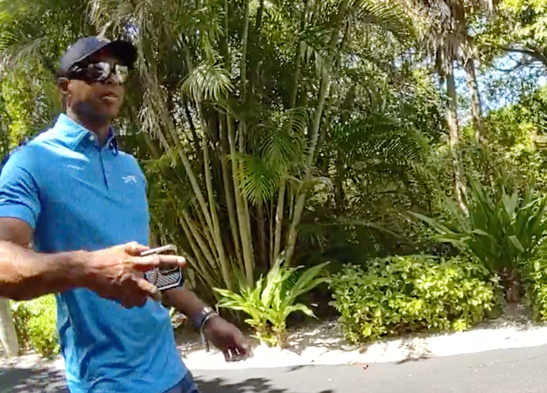 In this image from police body camera video released by the Martin County, Fla., Sheriff's Office, golfer lt;HIT gt;Tiger lt;/HIT gt; lt;HIT gt;Woods lt;/HIT gt; hangs up his cellphone and tells a sheriff deputy “I was just talking to the president" following a car crash in Jupiter Island, Fla., Friday, March 27, 2026. (Martin County Sheriff's Office via AP)