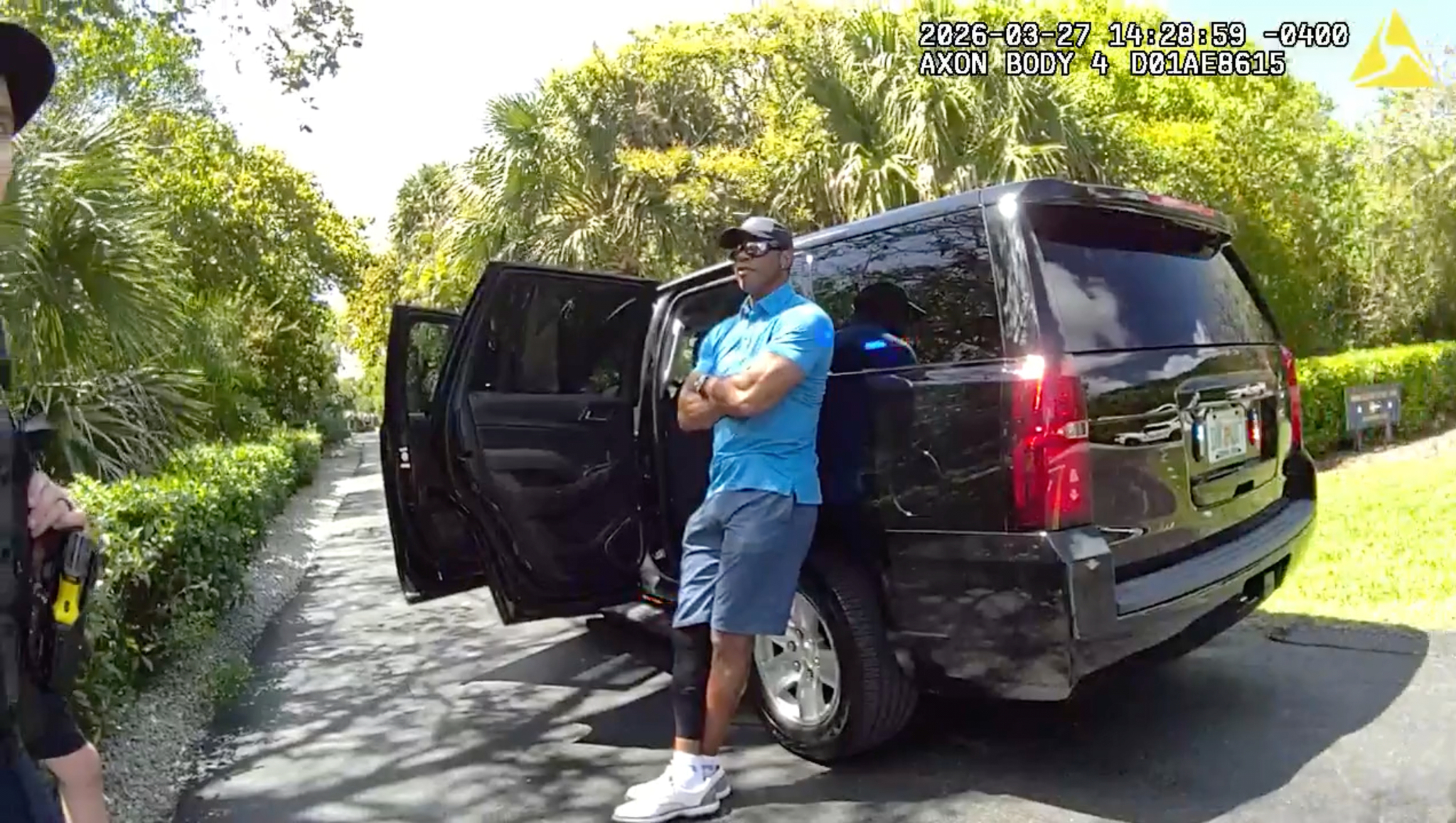 In this image from police body camera video released by the Martin County, Fla., Sheriff's Office, golfer lt;HIT gt;Tiger lt;/HIT gt; lt;HIT gt;Woods lt;/HIT gt; leans on an unmarked police vehicle following a car crash in Jupiter Island, Fla., Friday, March 27, 2026. (Martin County Sheriff's Office via AP)
