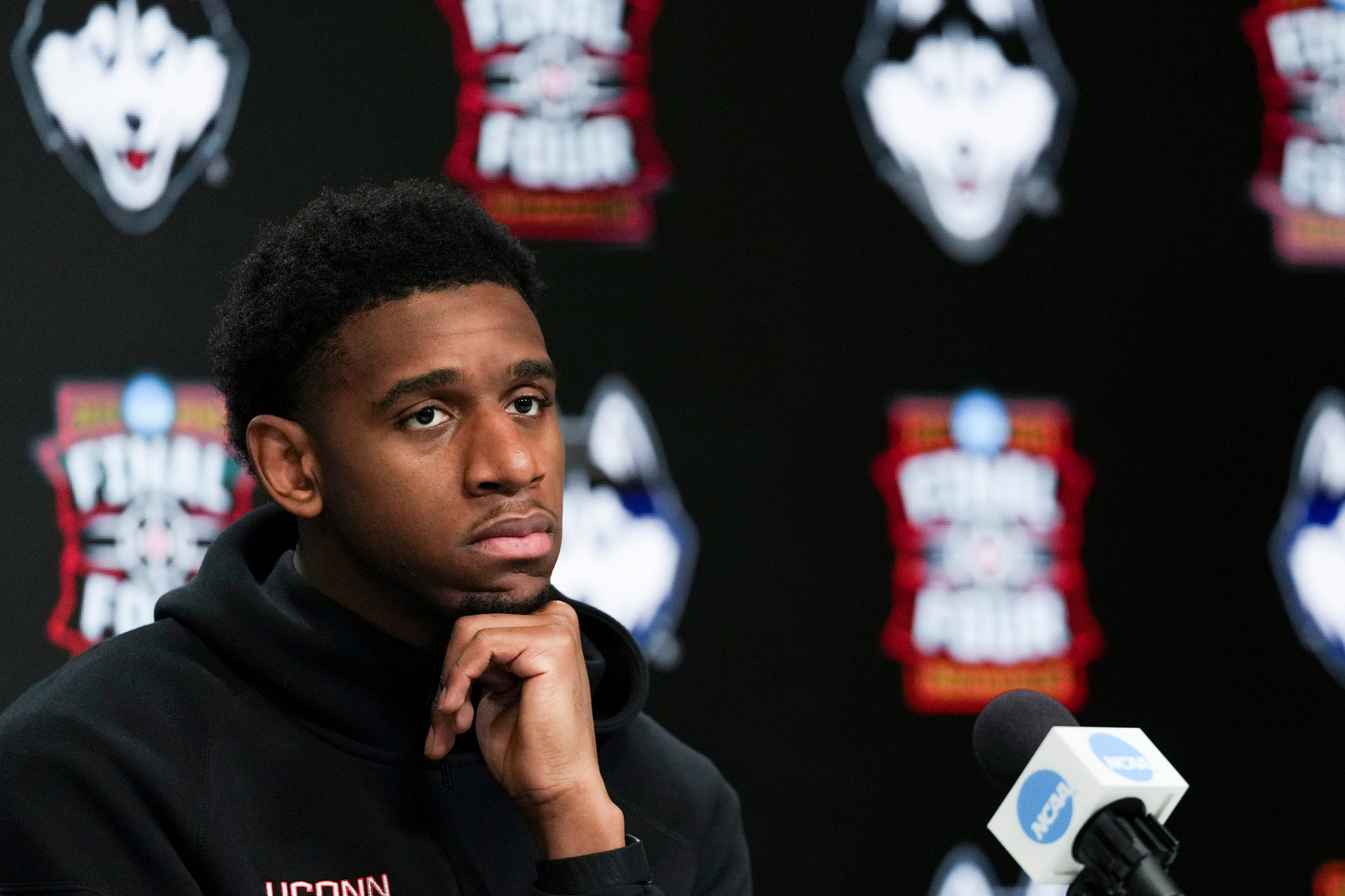 UConn forward Tarris Reed Jr. listens during a news conference ahead of a national championship NCAA college basketball tournament game against Michigan