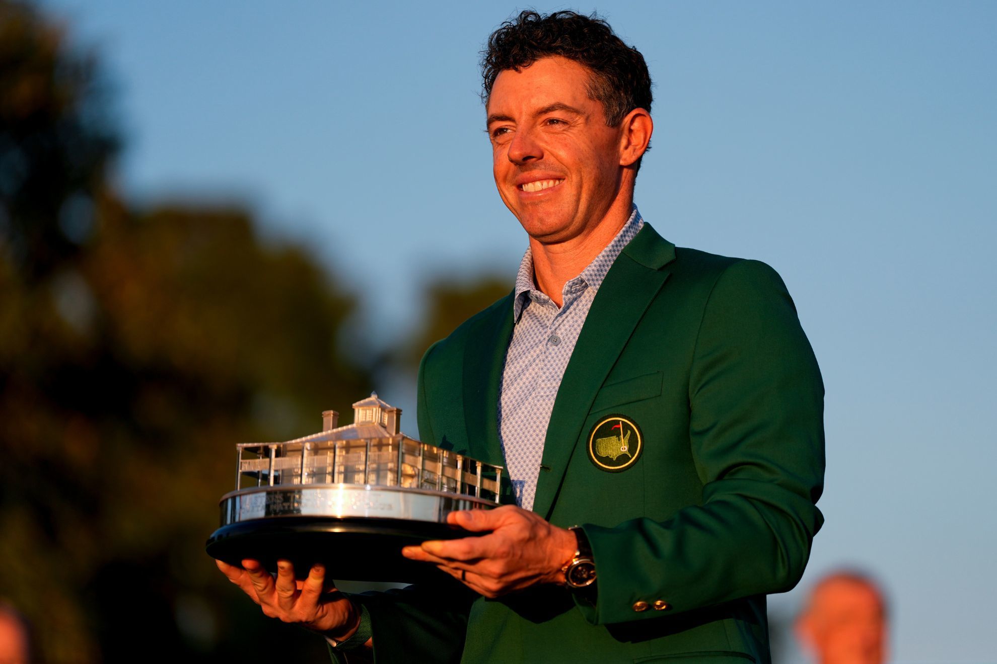 Rory McIlroy, of Northern Ireland, holds the trophy after winning the Masters golf tournament at the Augusta National Golf Club.