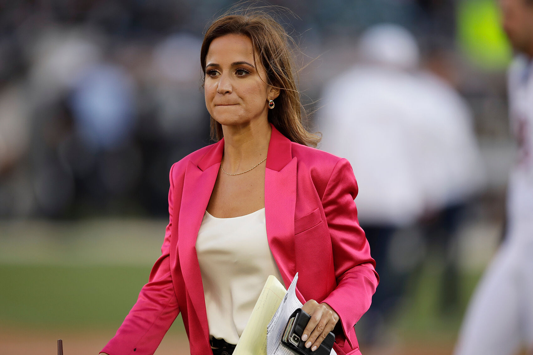 FILE- Reporter lt;HIT gt;Dianna lt;/HIT gt; lt;HIT gt;Russini lt;/HIT gt; works on the sidelines before the start of an NFL football game between the Oakland Raiders and the Denver Broncos Monday, Sept. 9, 2019, in Oakland, Calif. (AP Photo/Ben Margot, File)